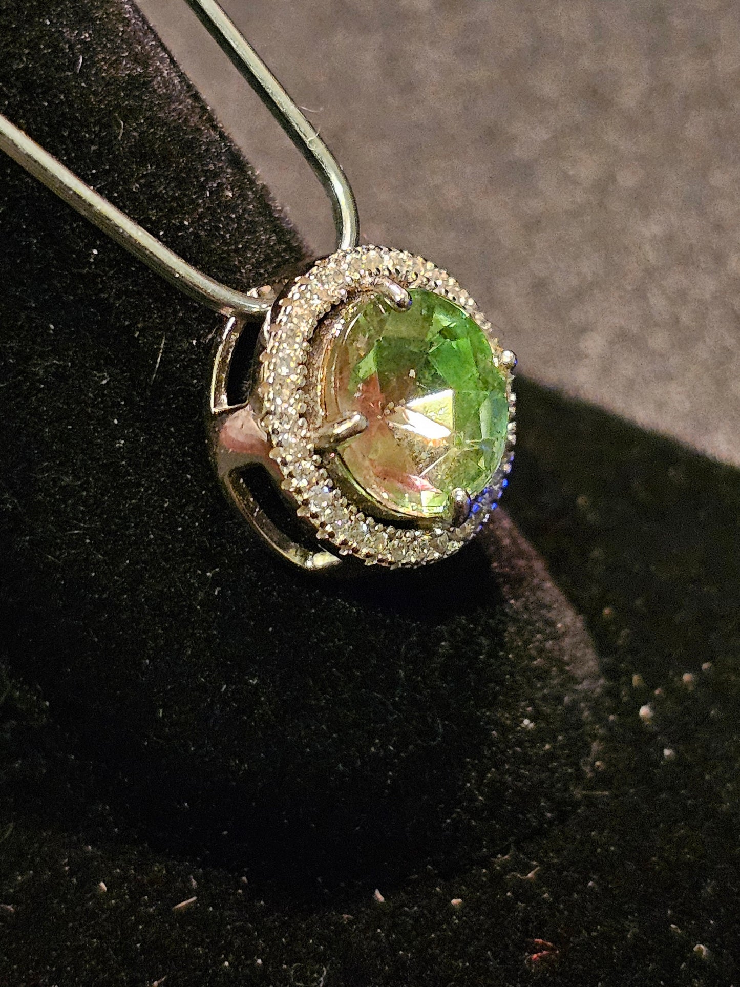 Uranium Glass Pendant in new Sterling Silver with a vintage 9 mm round cut Uranium Glass stone that glows under black / UV light