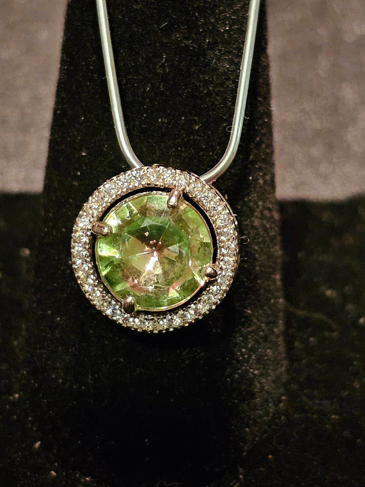Uranium Glass Pendant in new Sterling Silver with a vintage 9 mm round cut Uranium Glass stone that glows under black / UV light
