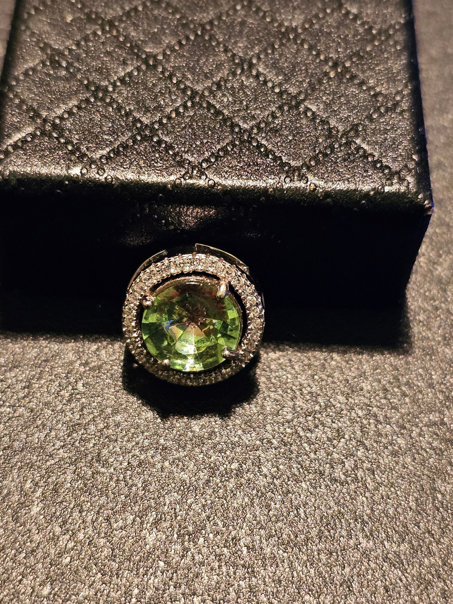 Uranium Glass Pendant in new Sterling Silver with a vintage 9 mm round cut Uranium Glass stone that glows under black / UV light