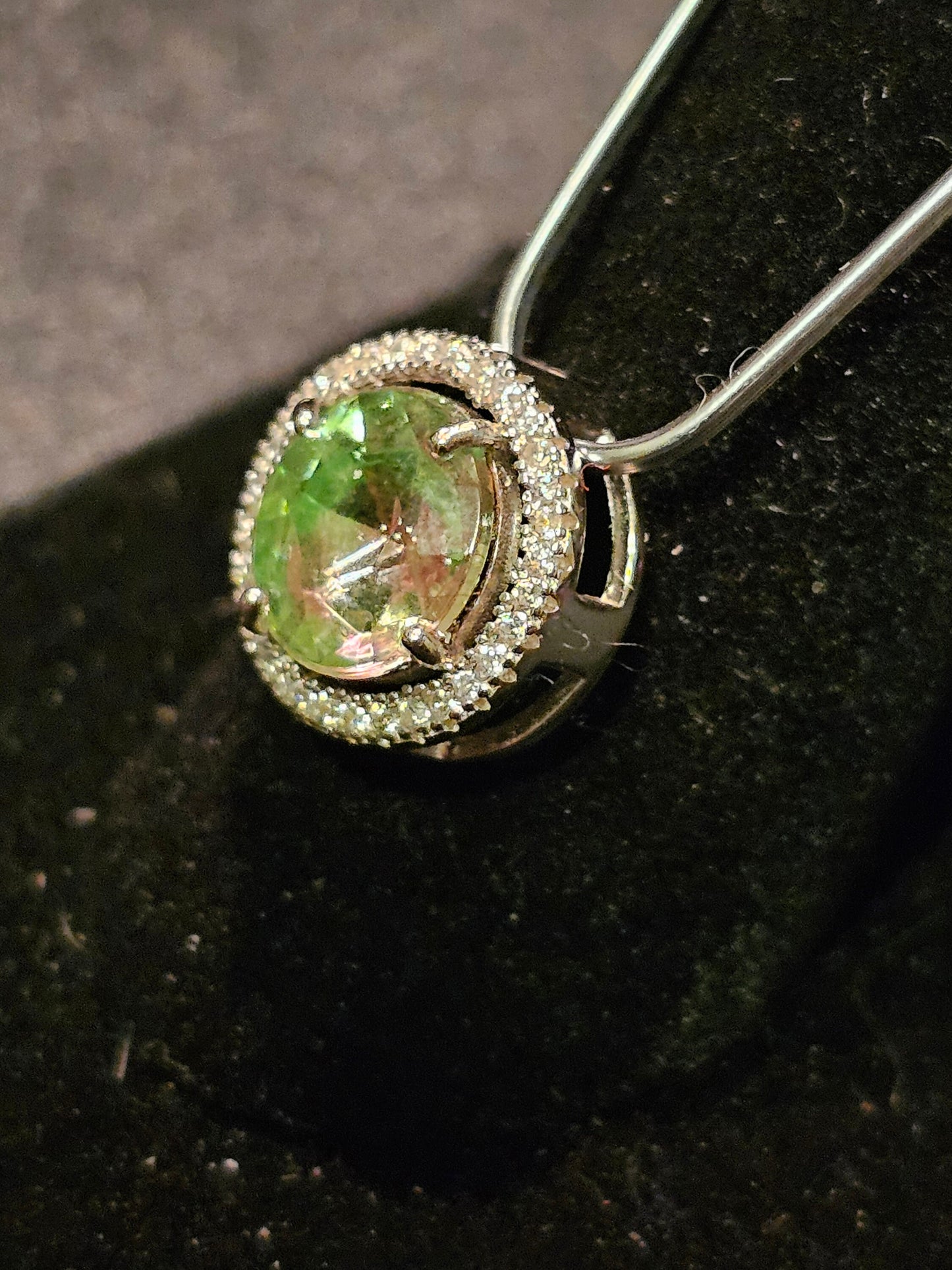 Uranium Glass Pendant in new Sterling Silver with a vintage 9 mm round cut Uranium Glass stone that glows under black / UV light
