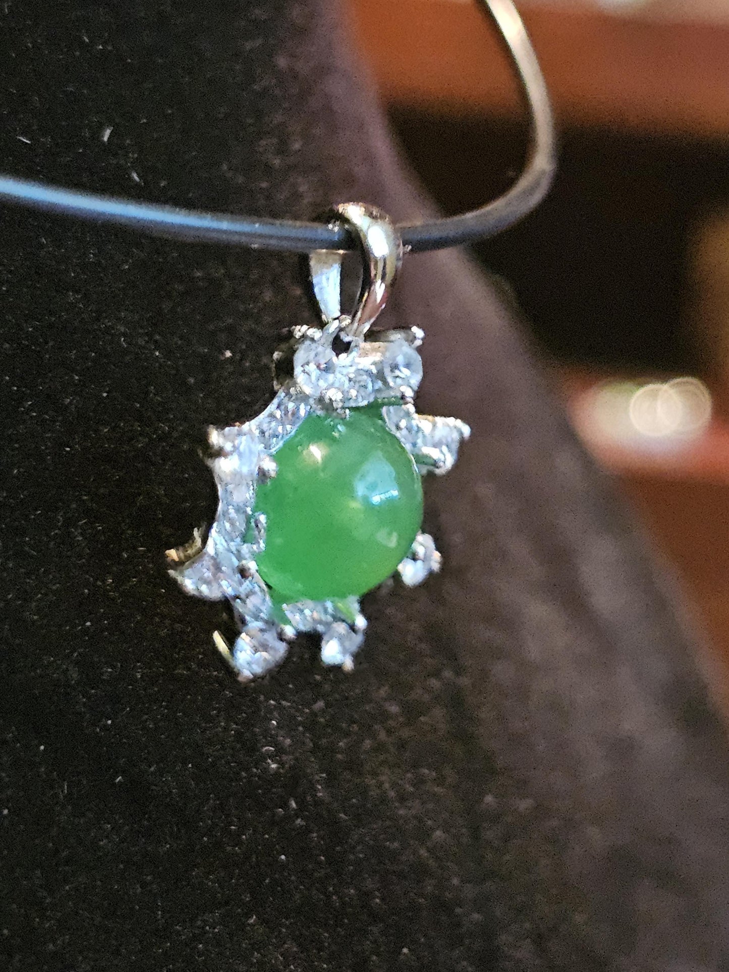 Uranium Glass pendant, with a vintage dark Green Round top Uranium glass stone that glows under black light mounted in new sterling silver