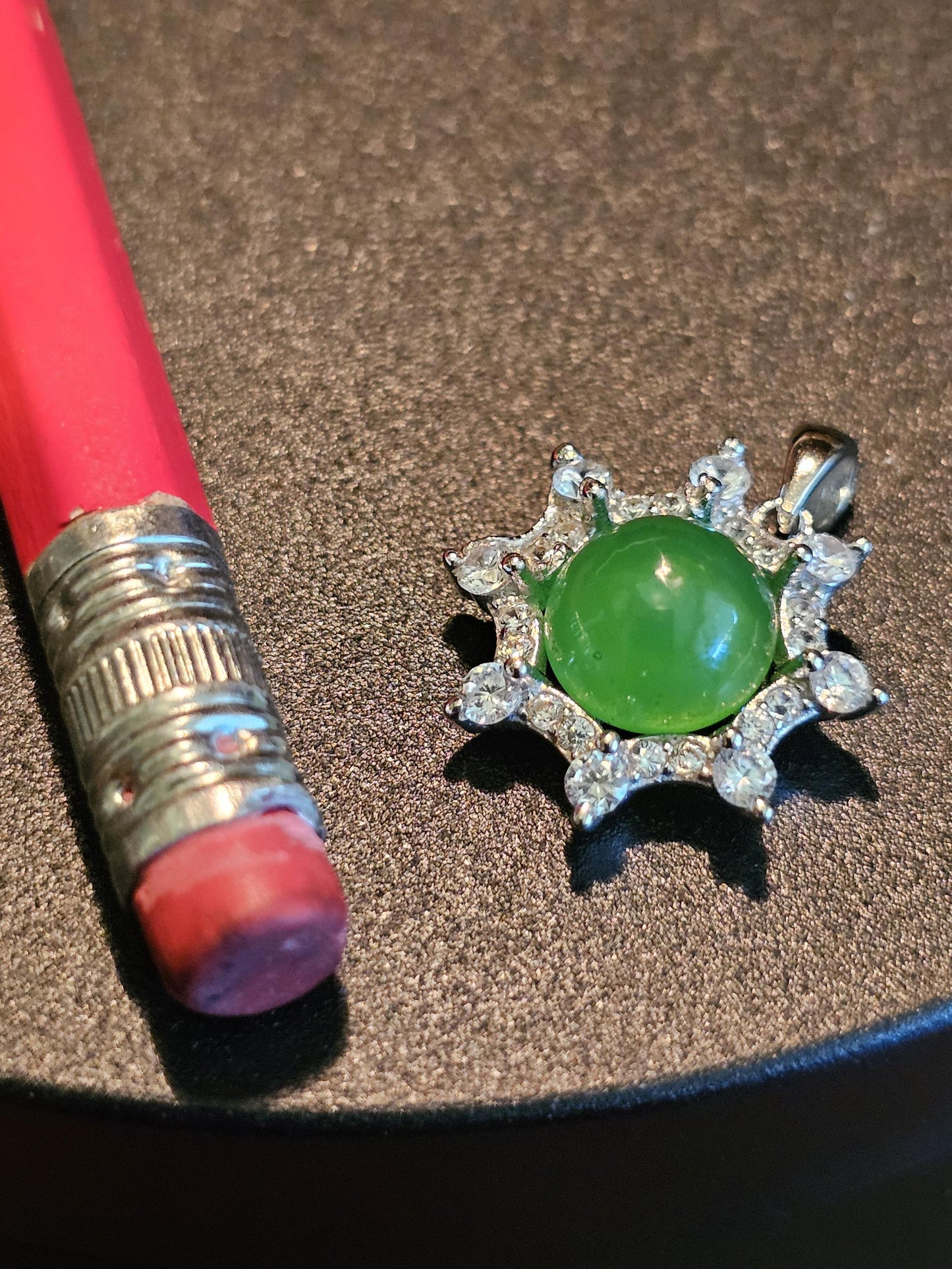 Uranium Glass pendant, with a vintage dark Green Round top Uranium glass stone that glows under black light mounted in new sterling silver