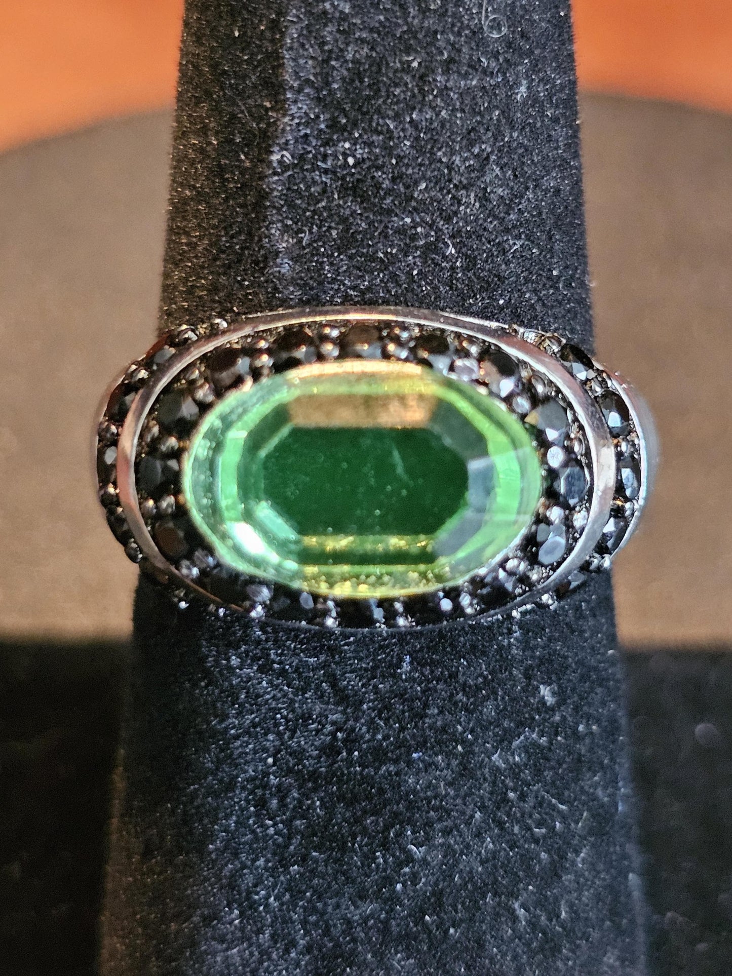 Uranium Glass Oval cut Ring with black Spindle accent stones, and a vintage Uranium glass 12x8 mm stone that glows under black / UV light