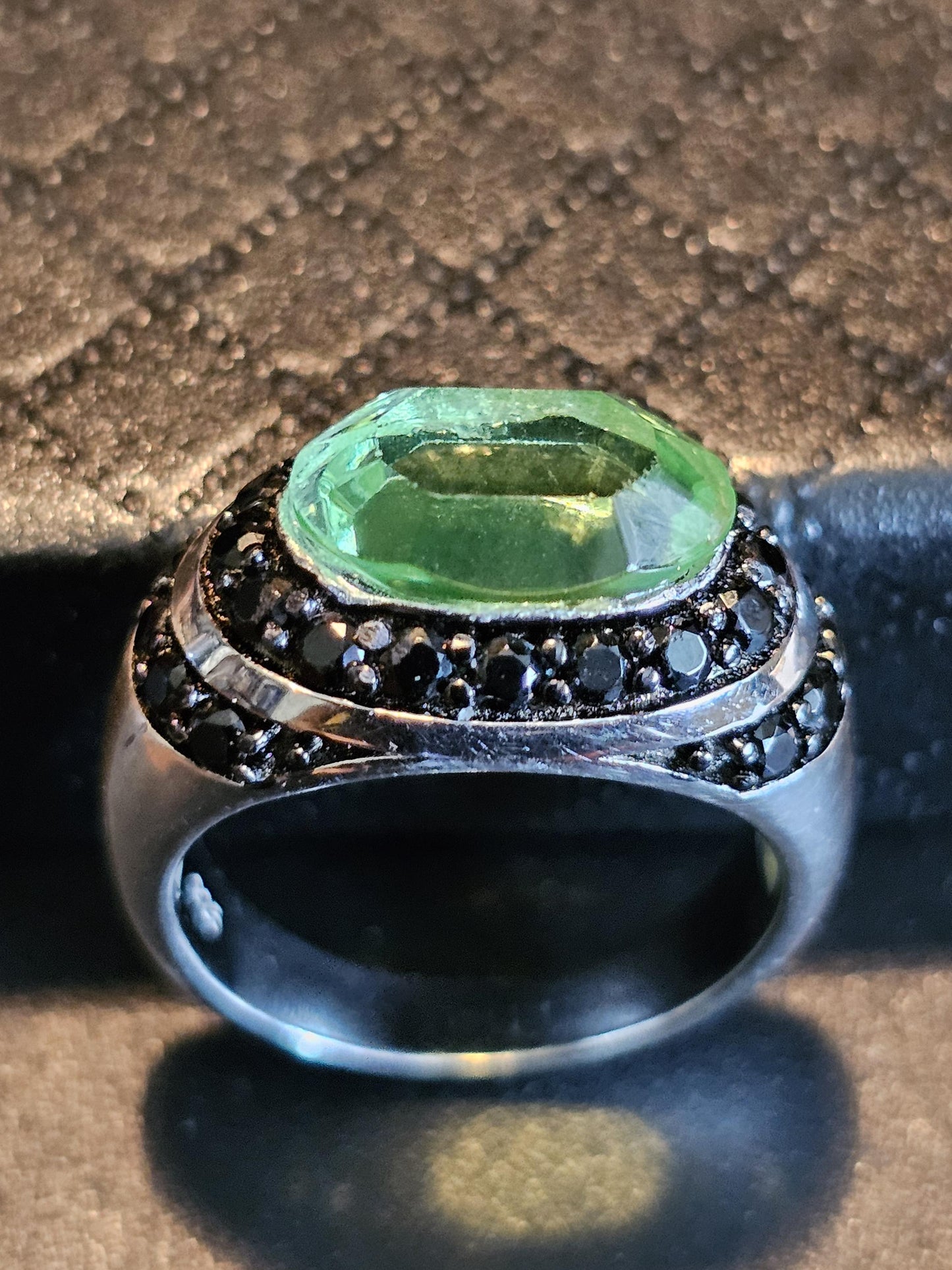 Uranium Glass Oval cut Ring with black Spindle accent stones, and a vintage Uranium glass 12x8 mm stone that glows under black / UV light