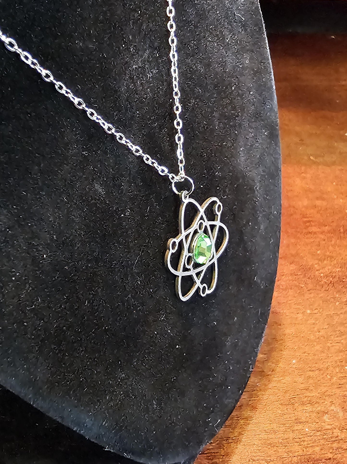 Uranium Glass Pendant in Stainless Steel setting with vintage 6 mm Round cut Cabochon Uranium Glass stone that glows under black / UV light