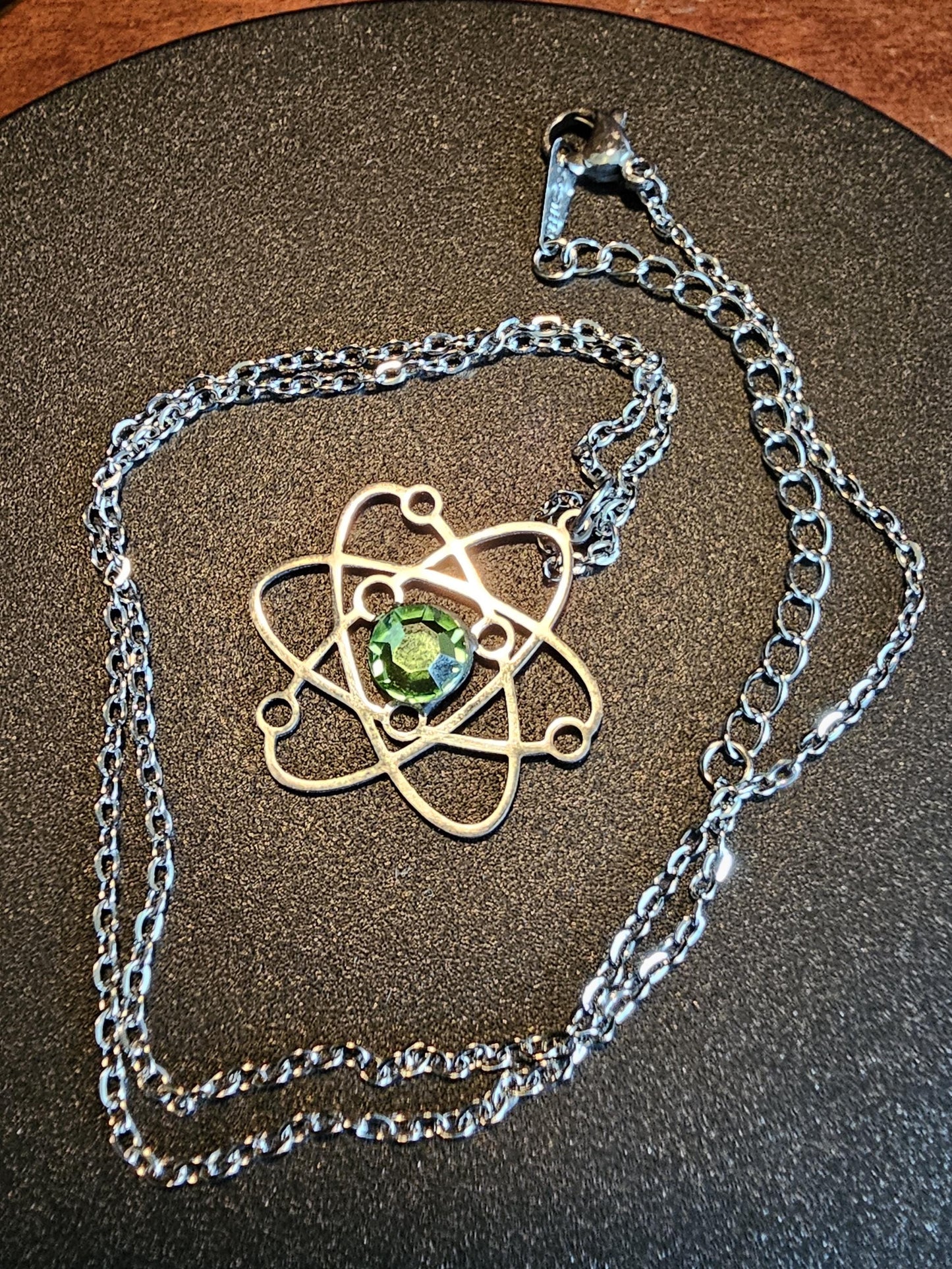 Uranium Glass Pendant in Stainless Steel setting with vintage 6 mm Round cut Cabochon Uranium Glass stone that glows under black / UV light