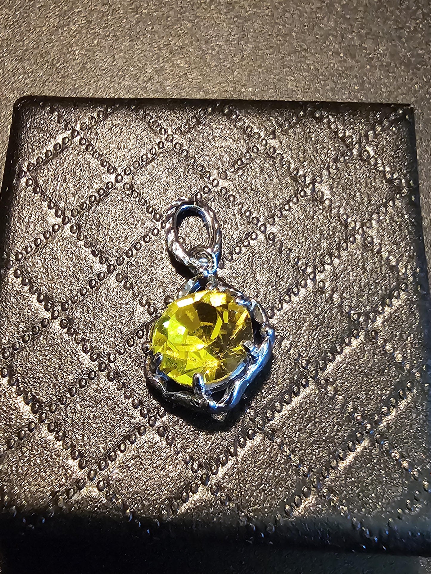 Cadmium Glass Pendant in new Sterling Silver with a vintage 8 mm Round cut Cadmium Glass stone that glows Orange under black / UV light