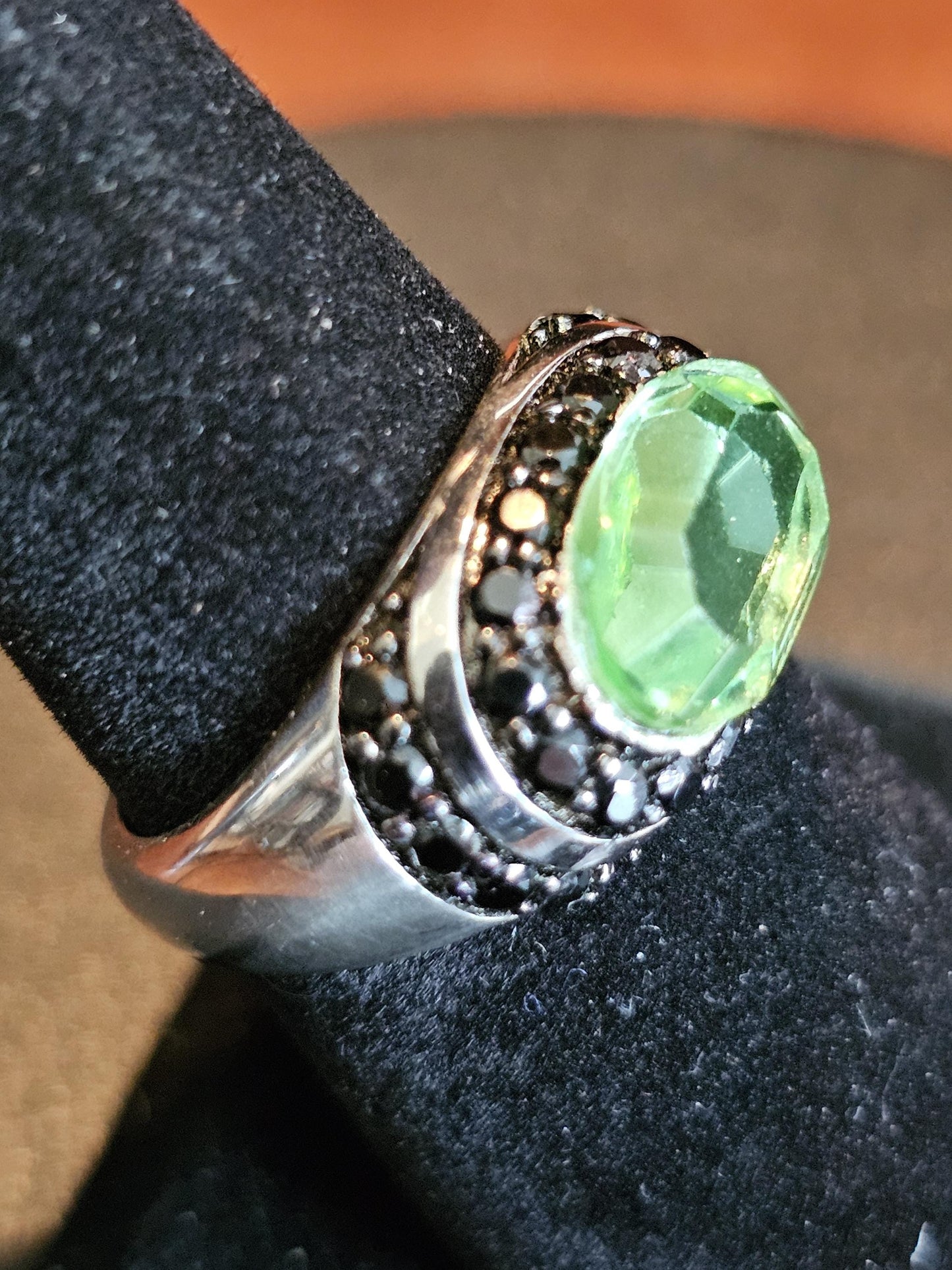 Uranium Glass Oval cut Ring with black Spindle accent stones, and a vintage Uranium glass 12x8 mm stone that glows under black / UV light