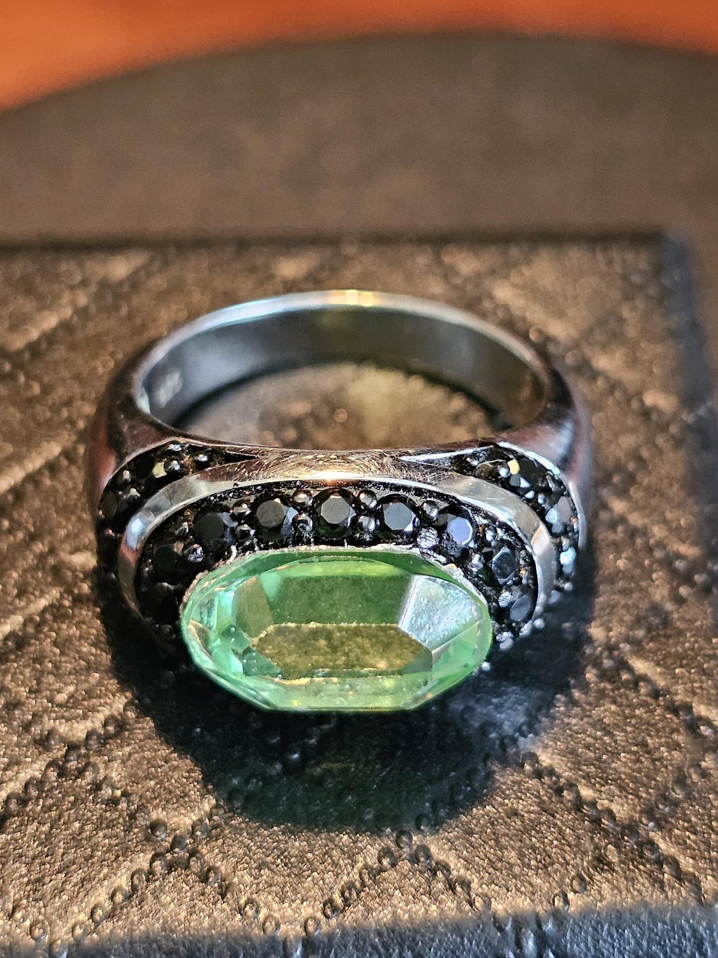 Uranium Glass Oval cut Ring with black Spindle accent stones, and a vintage Uranium glass 12x8 mm stone that glows under black / UV light