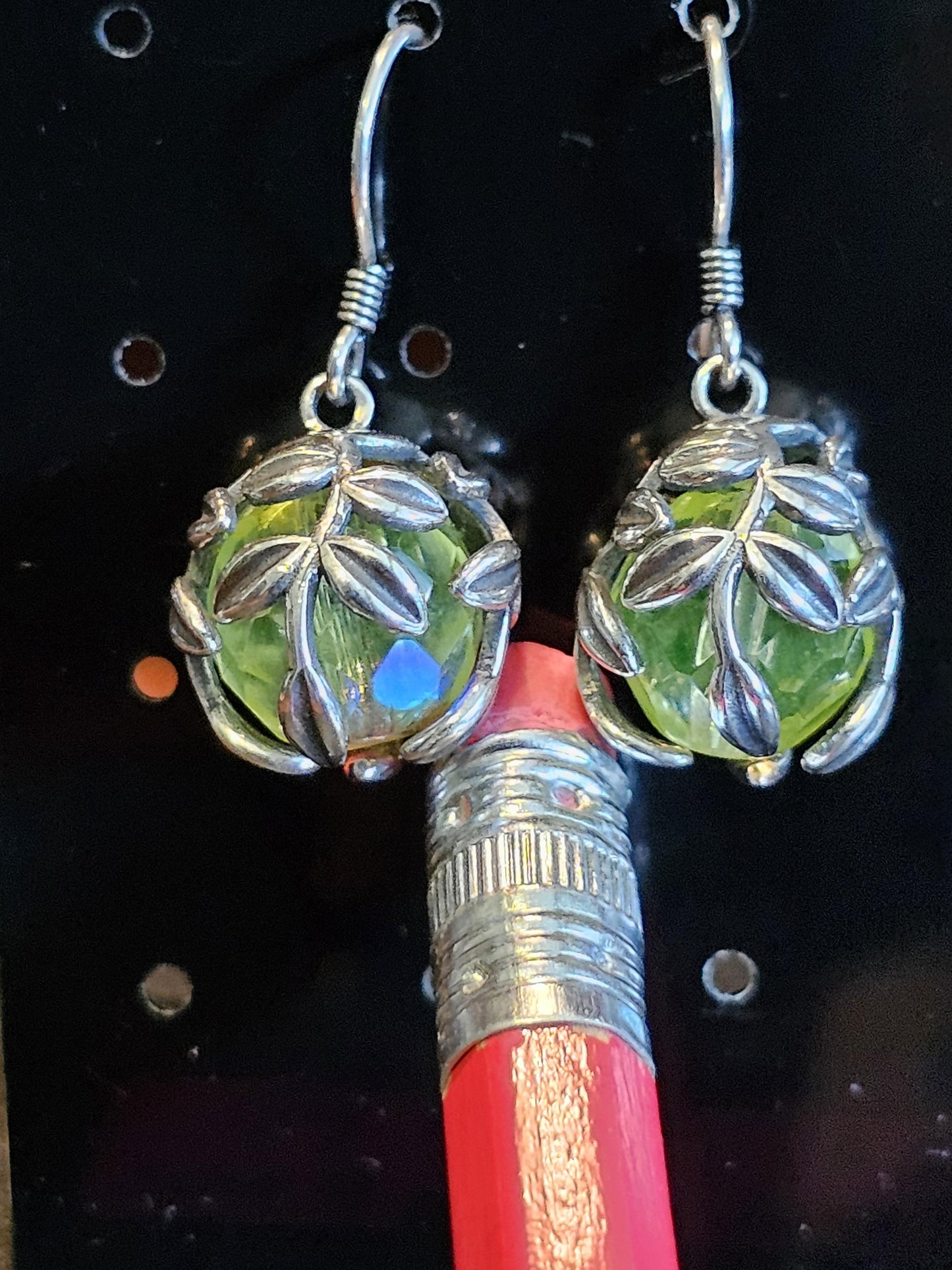 Uranium Glass Earrings in new Sterling Silver with a large vintage 12mm round cut Uranium Glass beads that glow under black / UV light