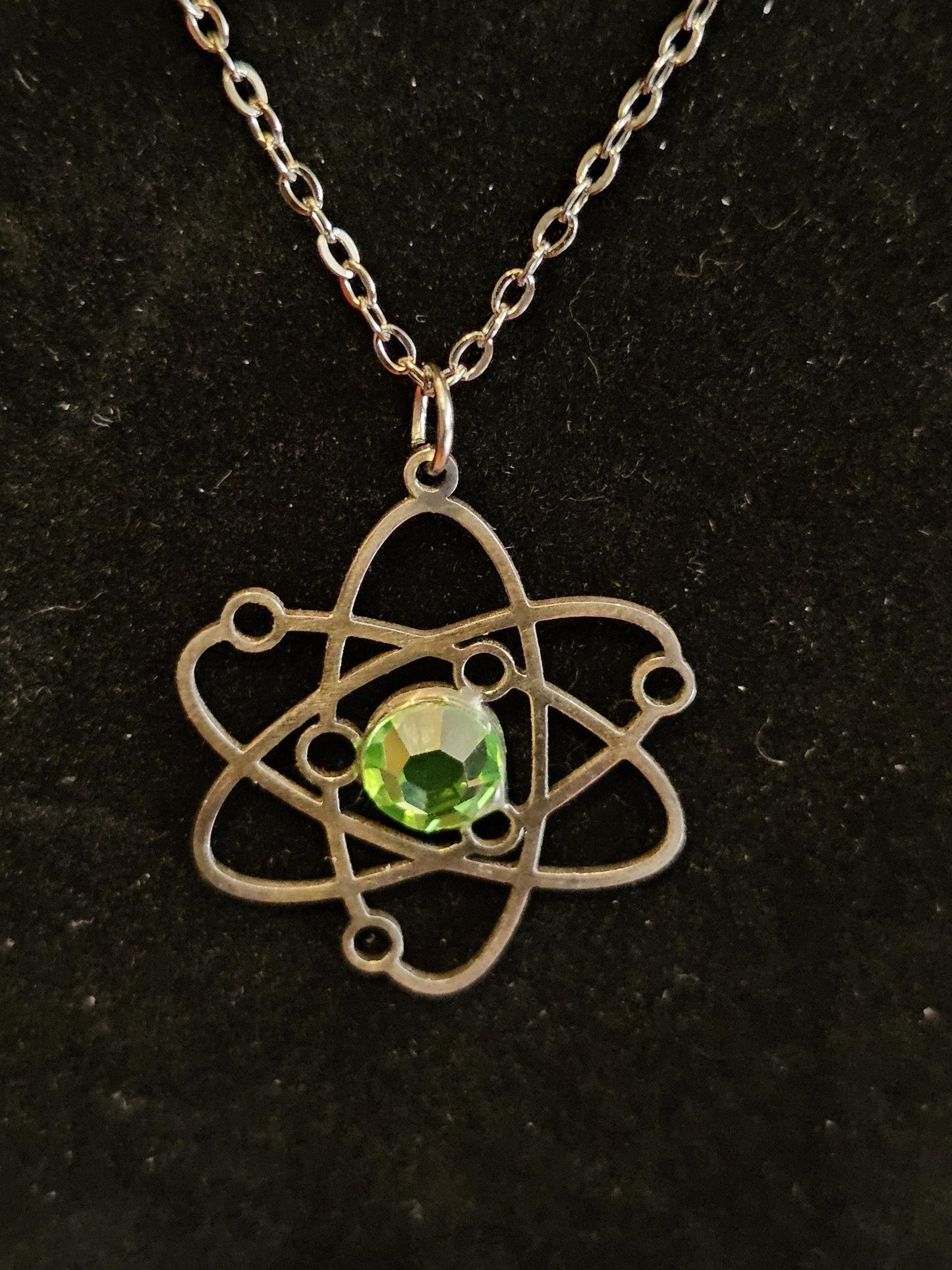 Uranium Glass Pendant in Stainless Steel setting with vintage 6 mm Round cut Cabochon Uranium Glass stone that glows under black / UV light