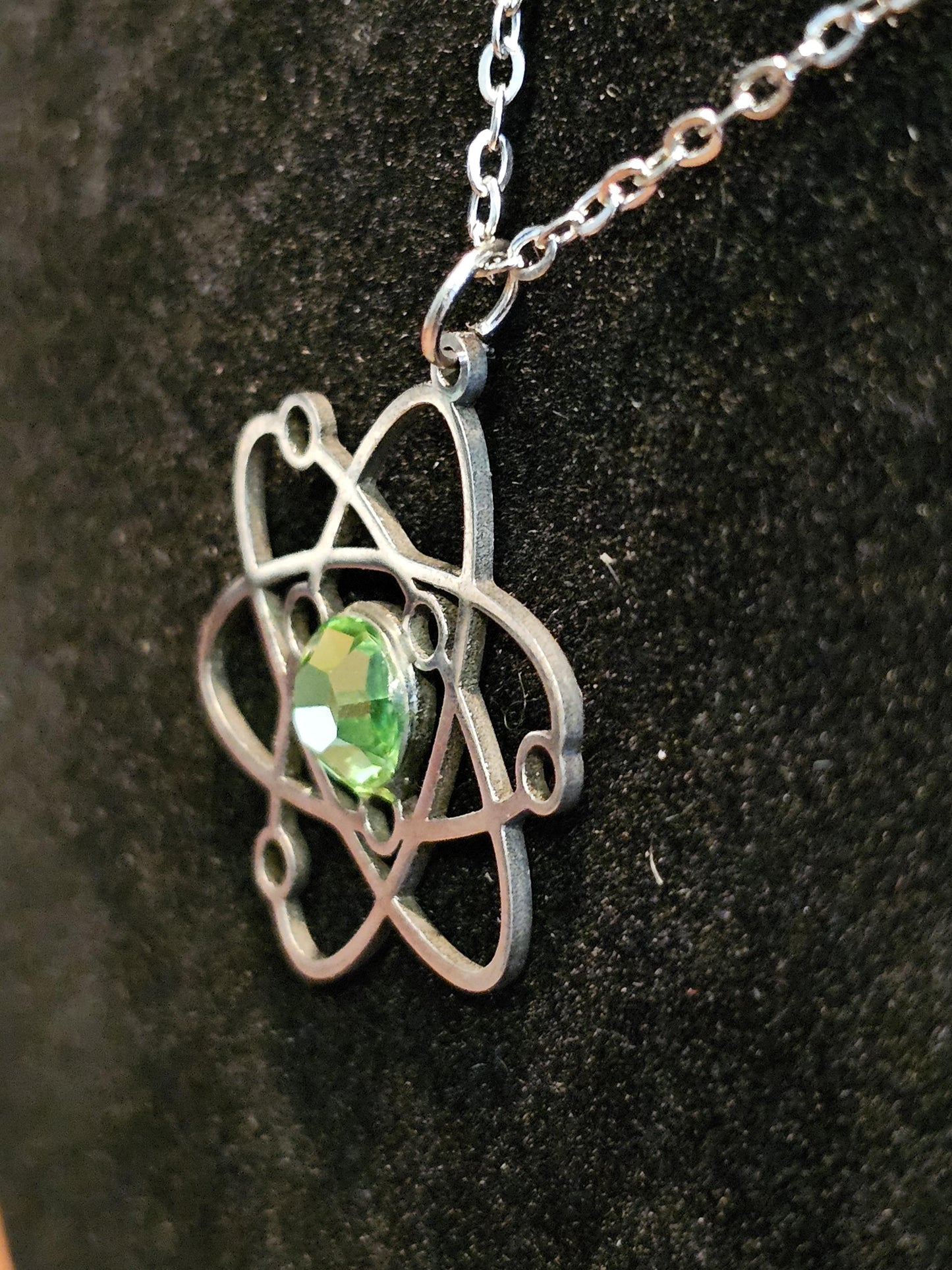 Uranium Glass Pendant in Stainless Steel setting with vintage 6 mm Round cut Cabochon Uranium Glass stone that glows under black / UV light
