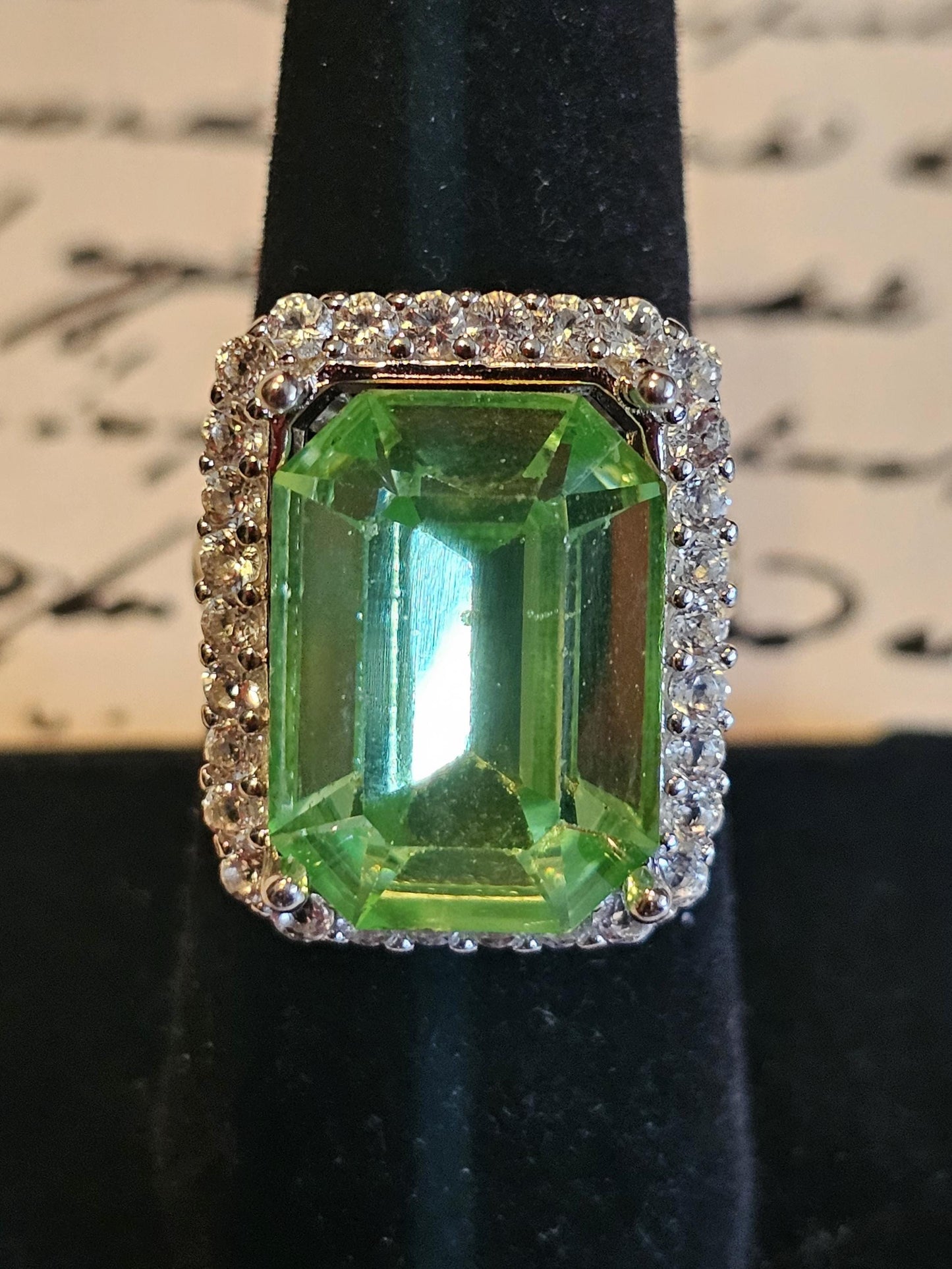 Uranium Glass Emerald cut Halo style ring in size 7, new Sterling Silver with vintage Uranium glass stone that glows under black / UV light