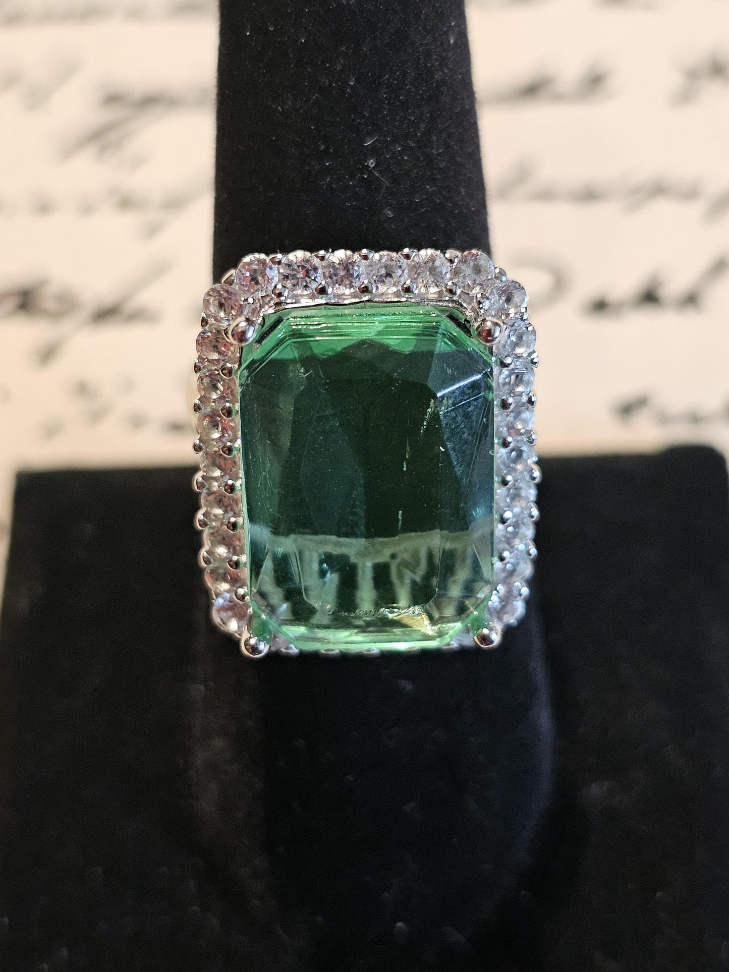 Uranium Glass Emerald cut Halo style ring in size 7, new Sterling Silver with vintage Uranium glass stone that glows under black / UV light