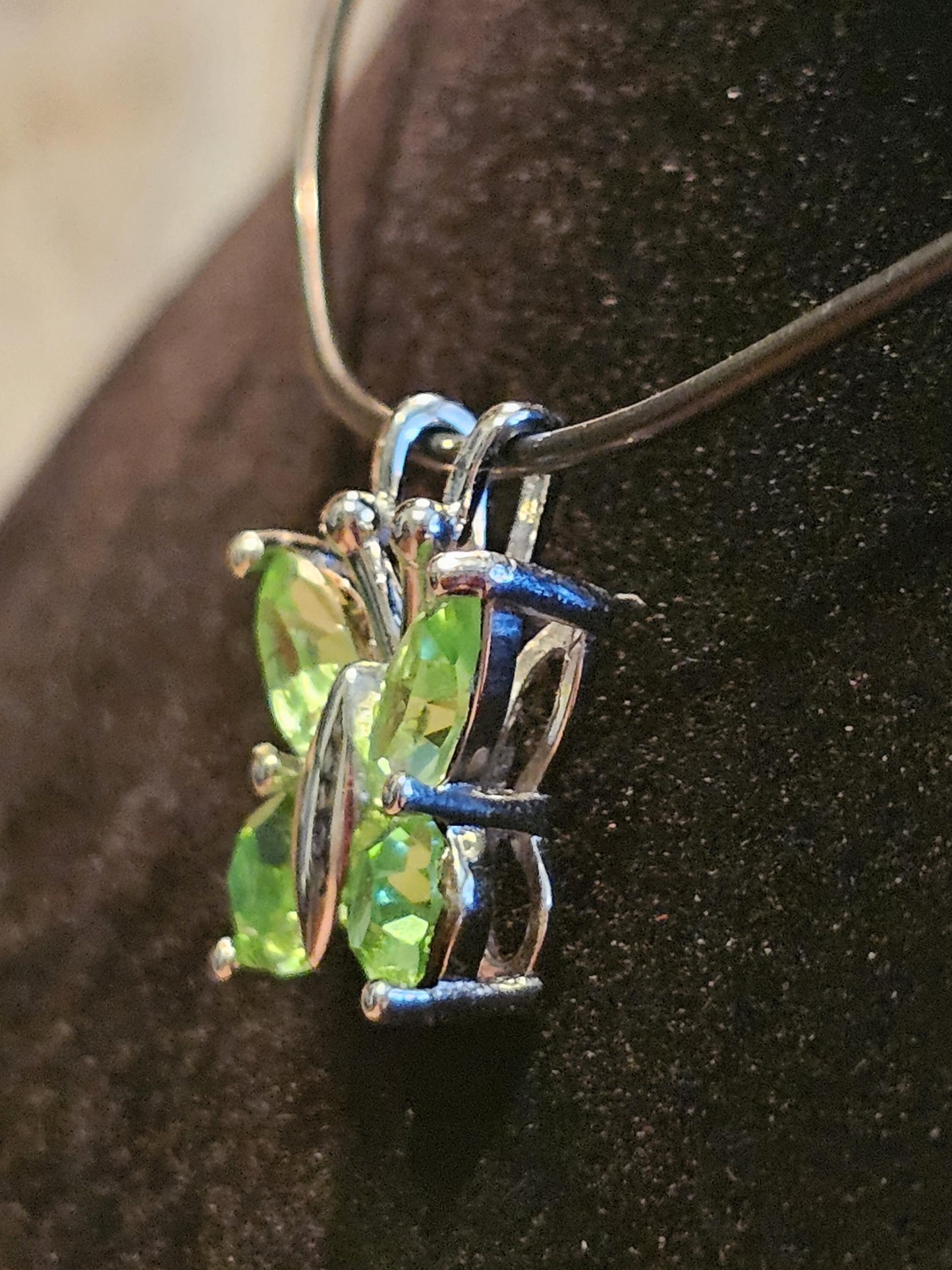 Uranium Glass Pendant in new Sterling Silver Butterfly design with Vintage Uranium Glass stones that glow under black / UV light