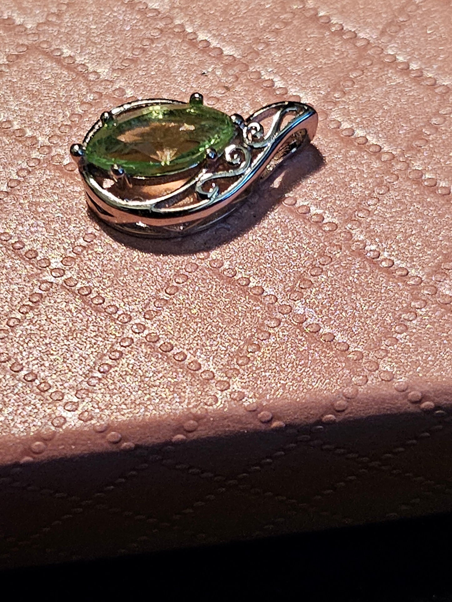 Uranium Glass Pendant in Sterling Silver with a vintage Marquee cut Uranium Glass stone glows under black / UV light