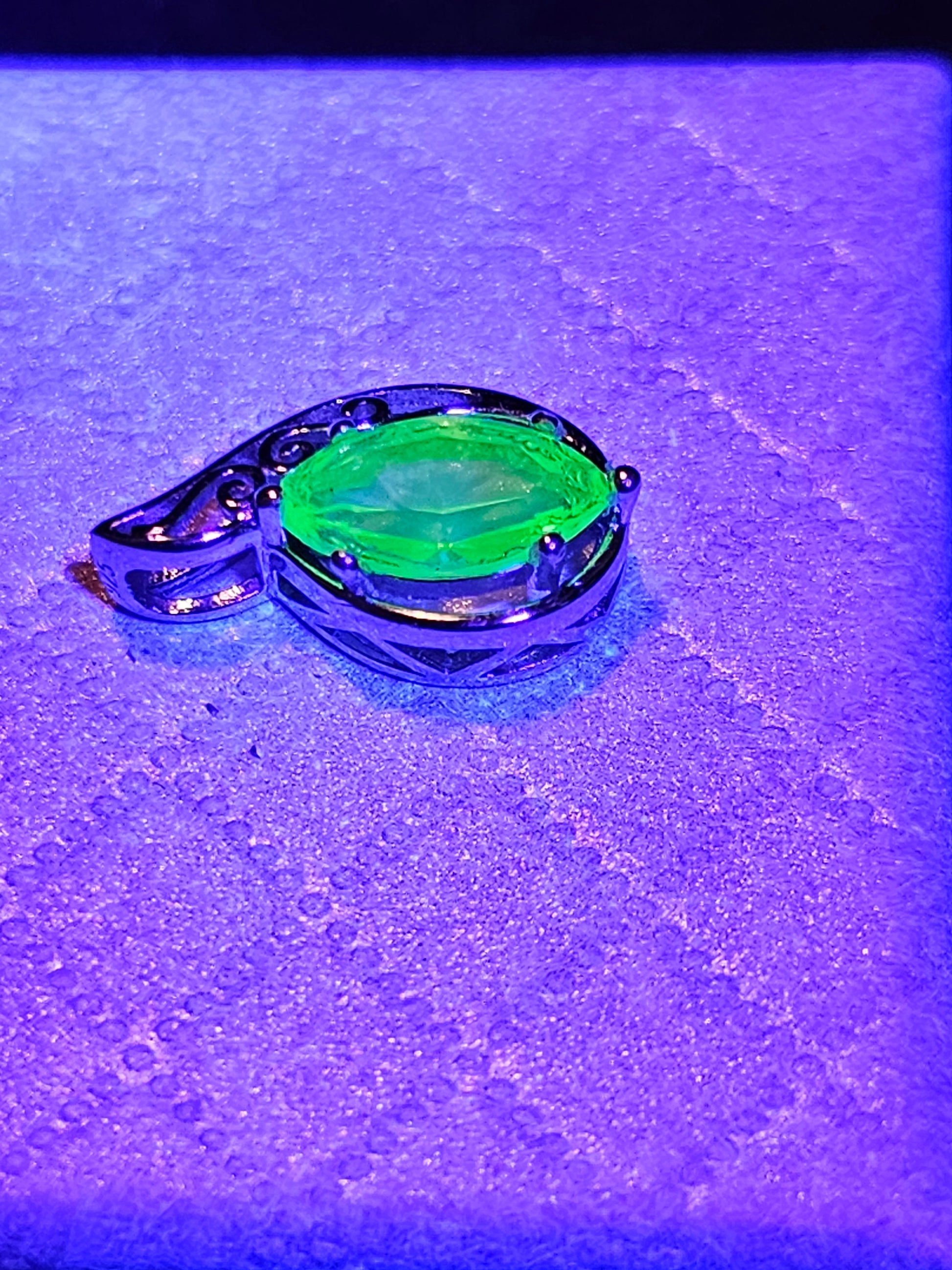 Uranium Glass Pendant in Sterling Silver with a vintage Marquee cut Uranium Glass stone glows under black / UV light