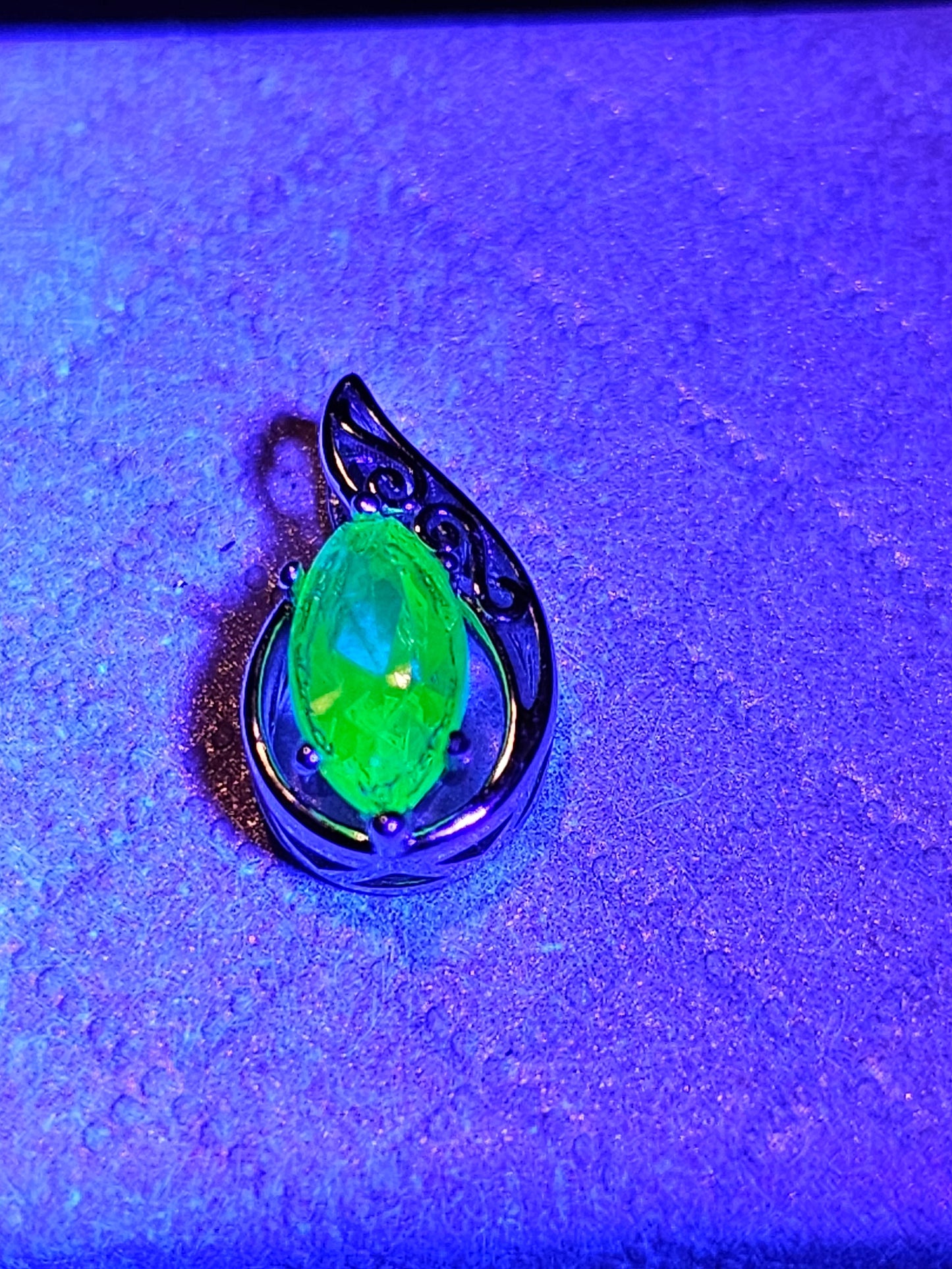 Uranium Glass Pendant in Sterling Silver with a vintage Marquee cut Uranium Glass stone glows under black / UV light