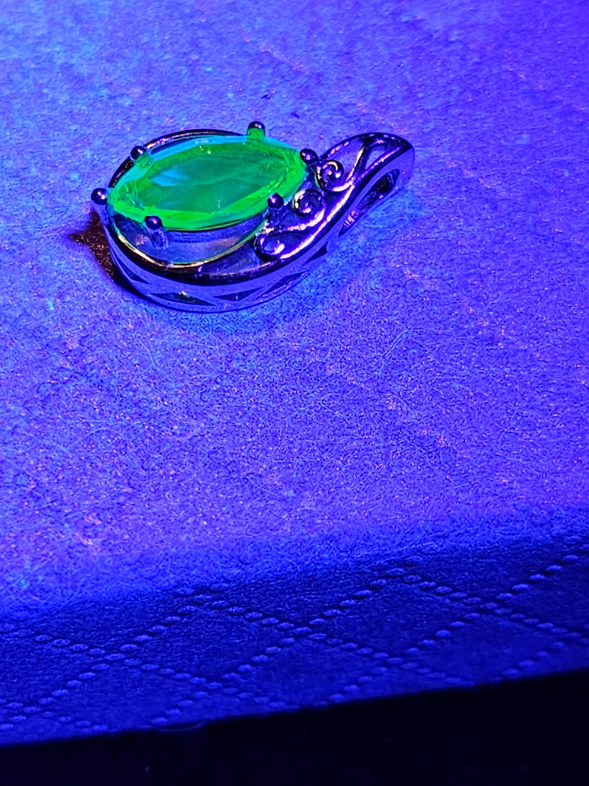 Uranium Glass Pendant in Sterling Silver with a vintage Marquee cut Uranium Glass stone glows under black / UV light