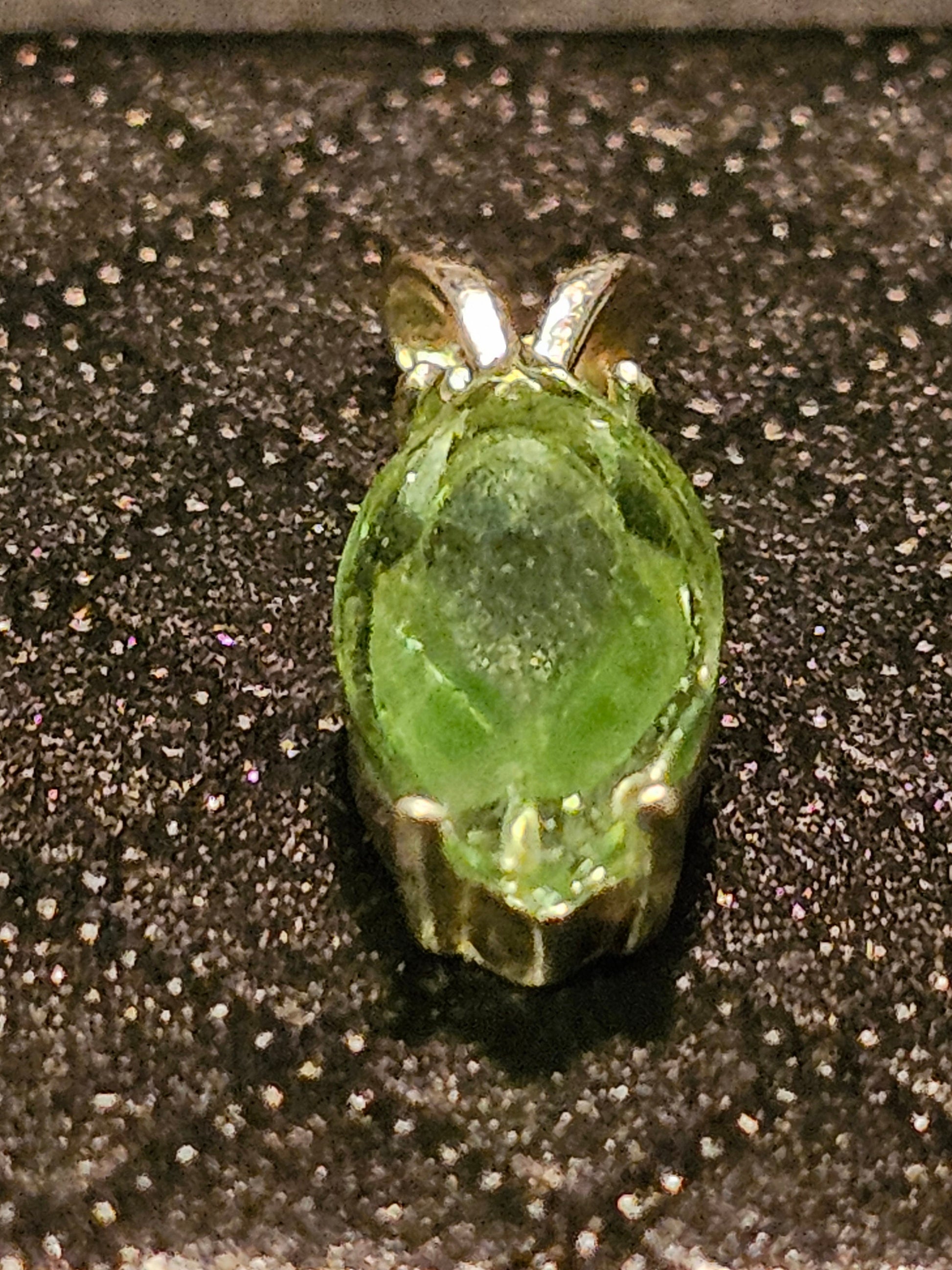 Uranium Glass Pendant in Sterling Silver with a vintage Marquee cut Uranium Glass stone glows under black / UV light