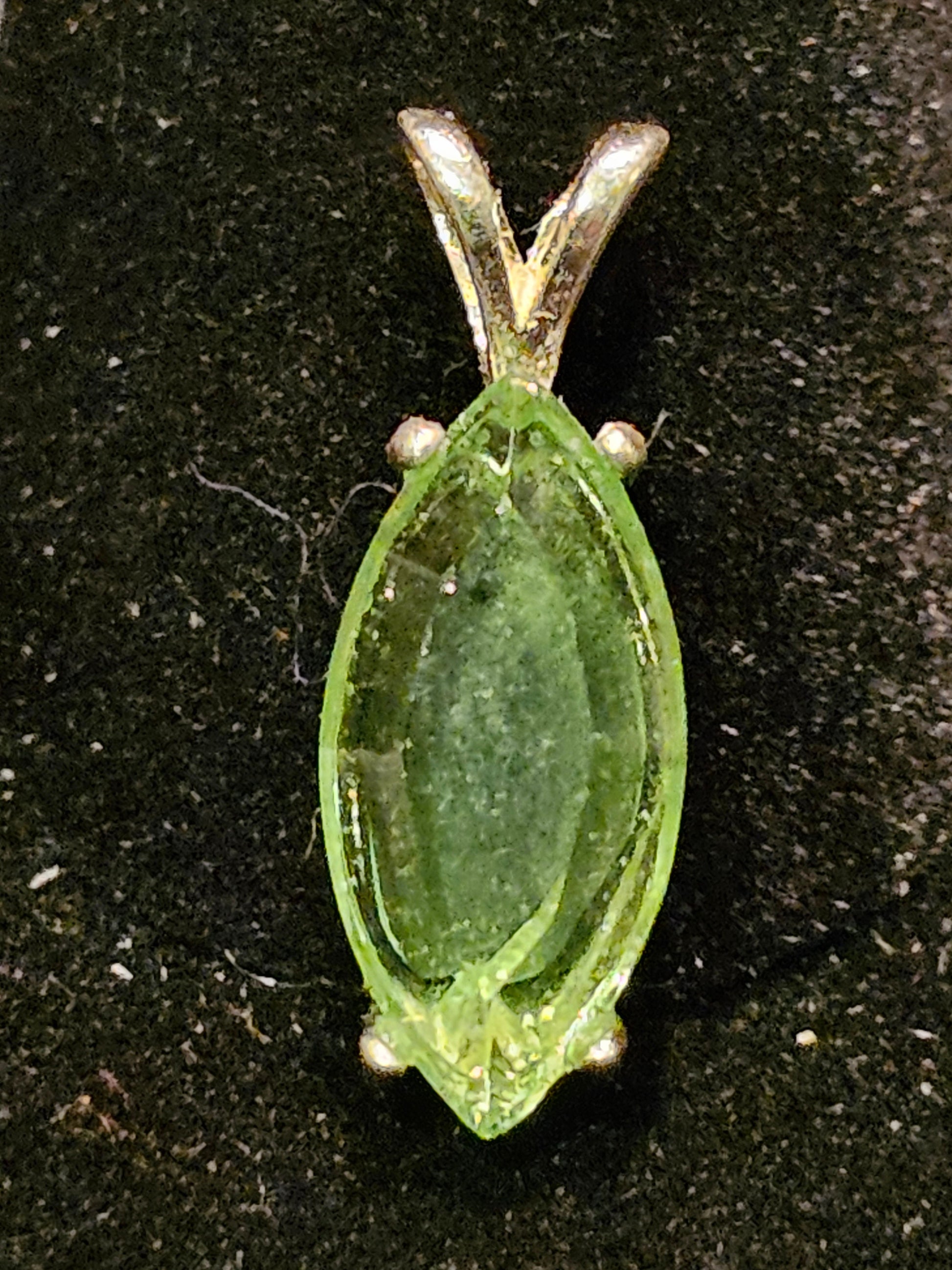 Uranium Glass Pendant in Sterling Silver with a vintage Marquee cut Uranium Glass stone glows under black / UV light