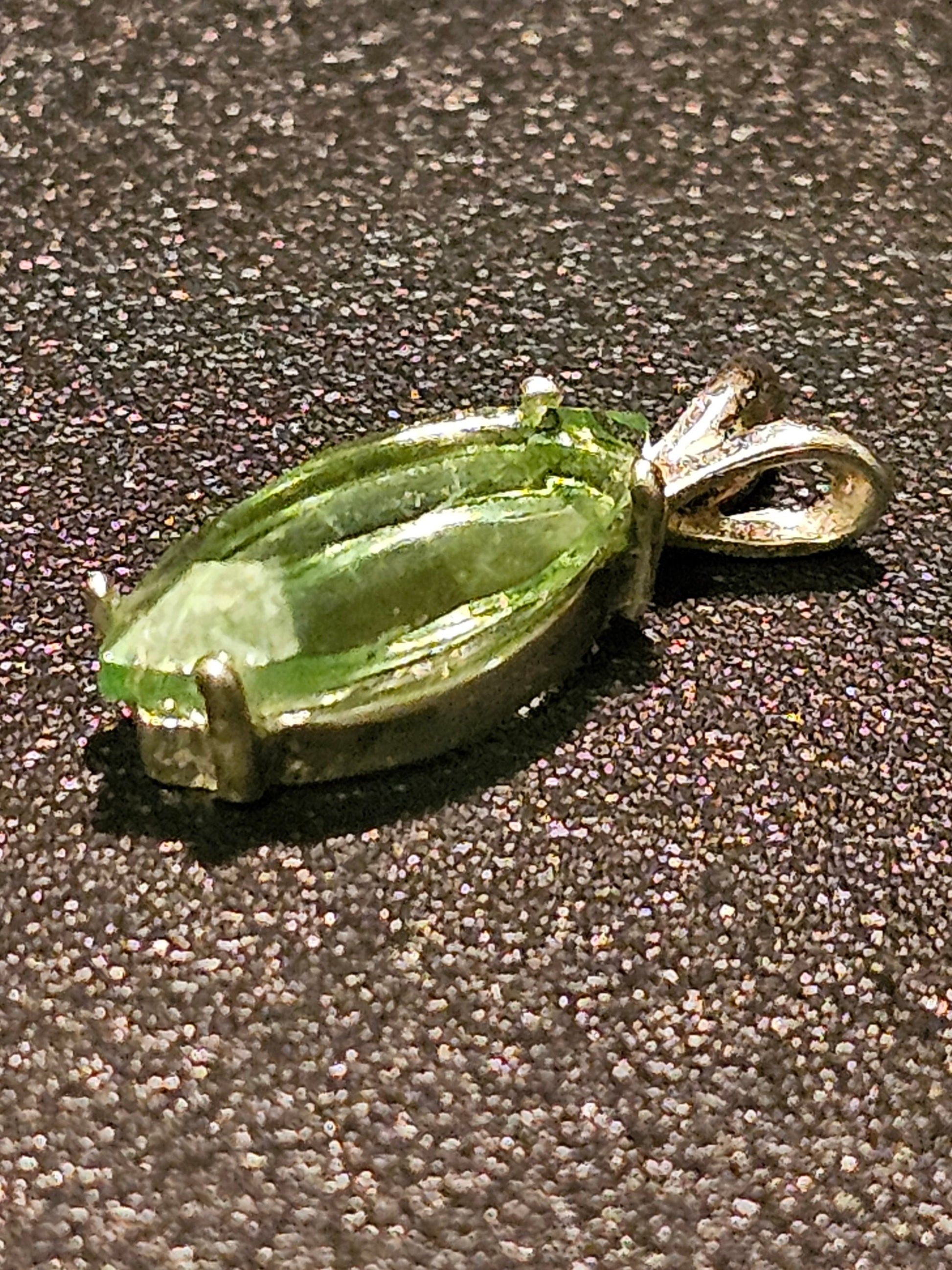 Uranium Glass Pendant in Sterling Silver with a vintage Marquee cut Uranium Glass stone glows under black / UV light