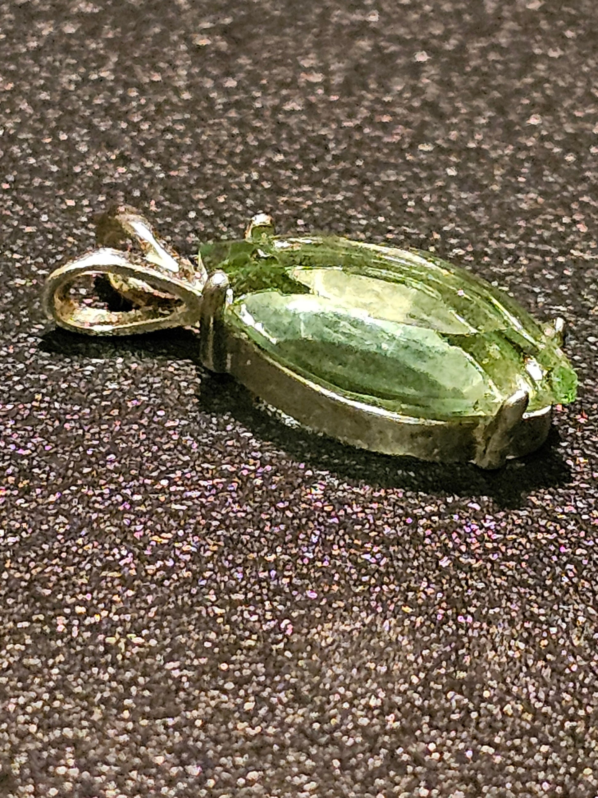 Uranium Glass Pendant in Sterling Silver with a vintage Marquee cut Uranium Glass stone glows under black / UV light