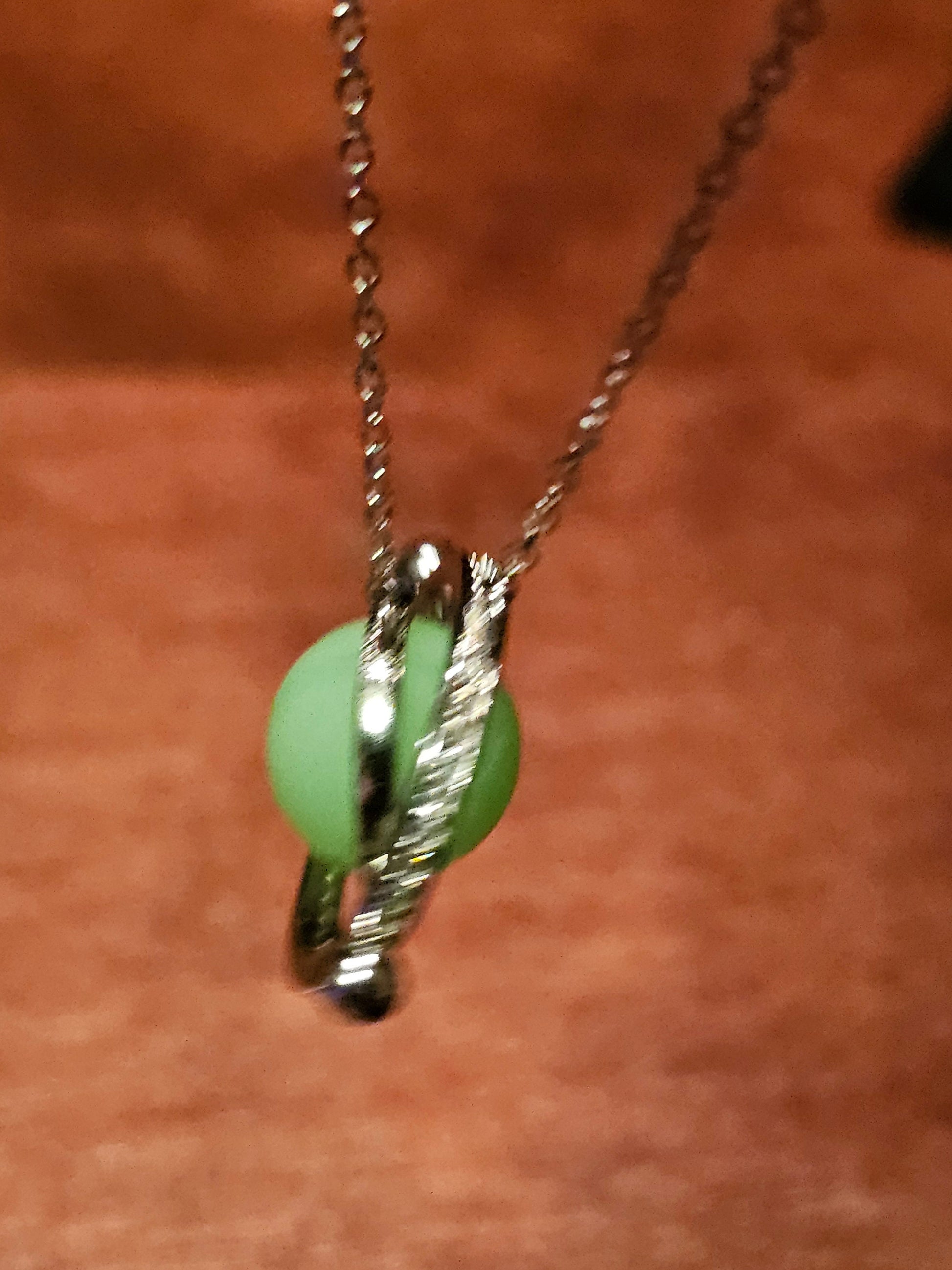 Uranium Glass Pendant with chain in new Sterling Silver with a vintage 9 mm round Uranium Glass bead that glows under black / UV light