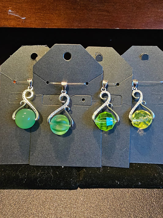 Uranium Glass Pendant in new Sterling Silver with a vintage 12 mm round Uranium Glass bead that glows under black / UV light