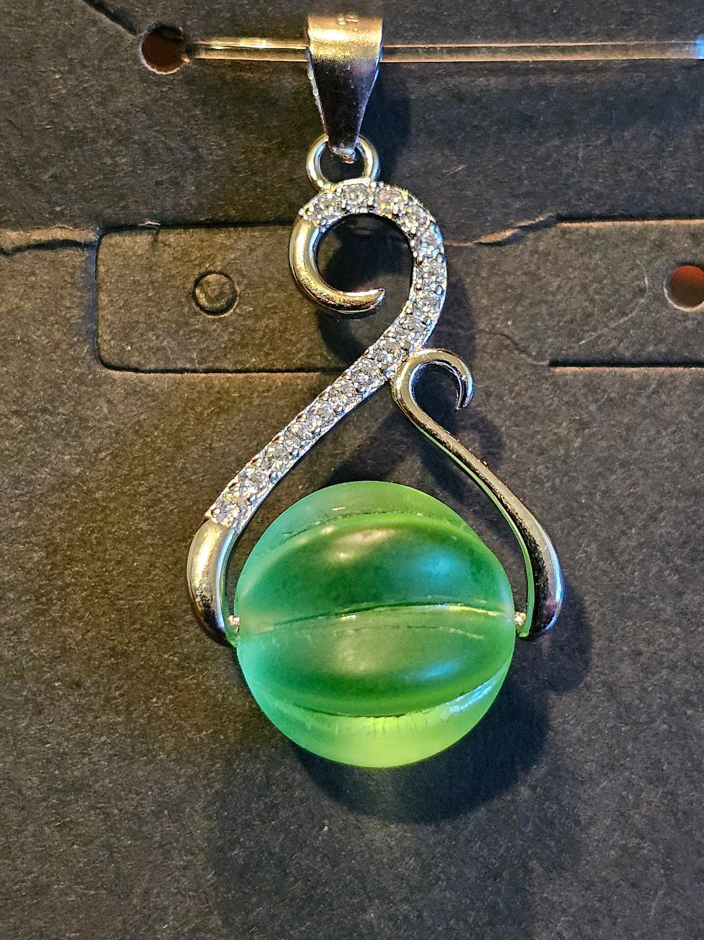 Uranium Glass Pendant in new Sterling Silver with a vintage 12 mm round Uranium Glass bead that glows under black / UV light