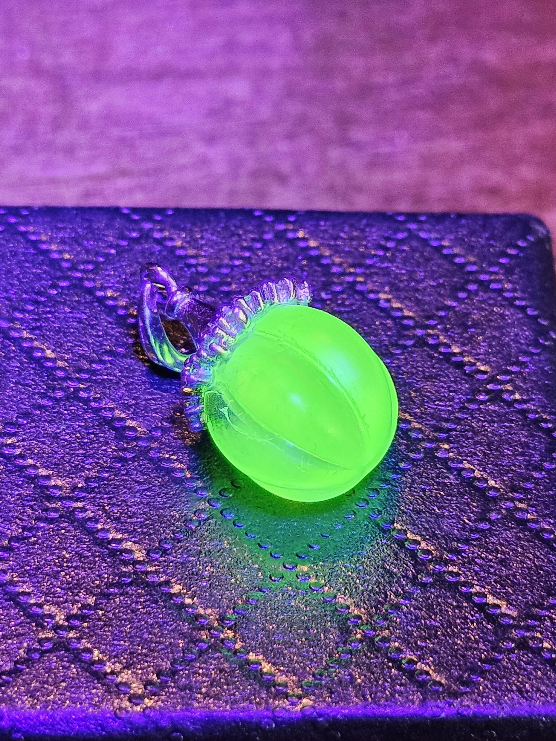 Uranium Glass Pendant in new Sterling Silver with a vintage 12 mm round Uranium Glass bead that glows under black / UV light