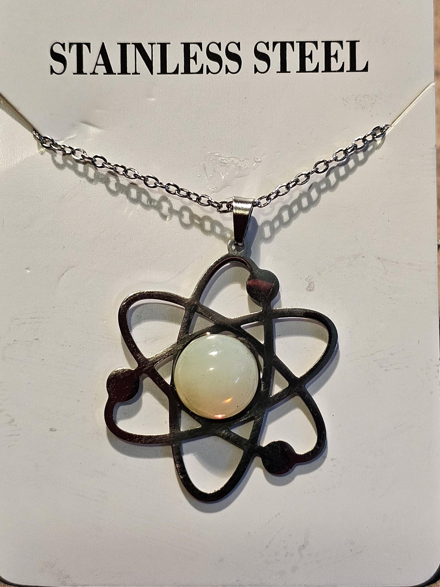 Uranium Glass Pendant in Stainless Steel setting with vintage 11 mm Round cut Cabochon Uranium Glass stone that glows under black / UV light