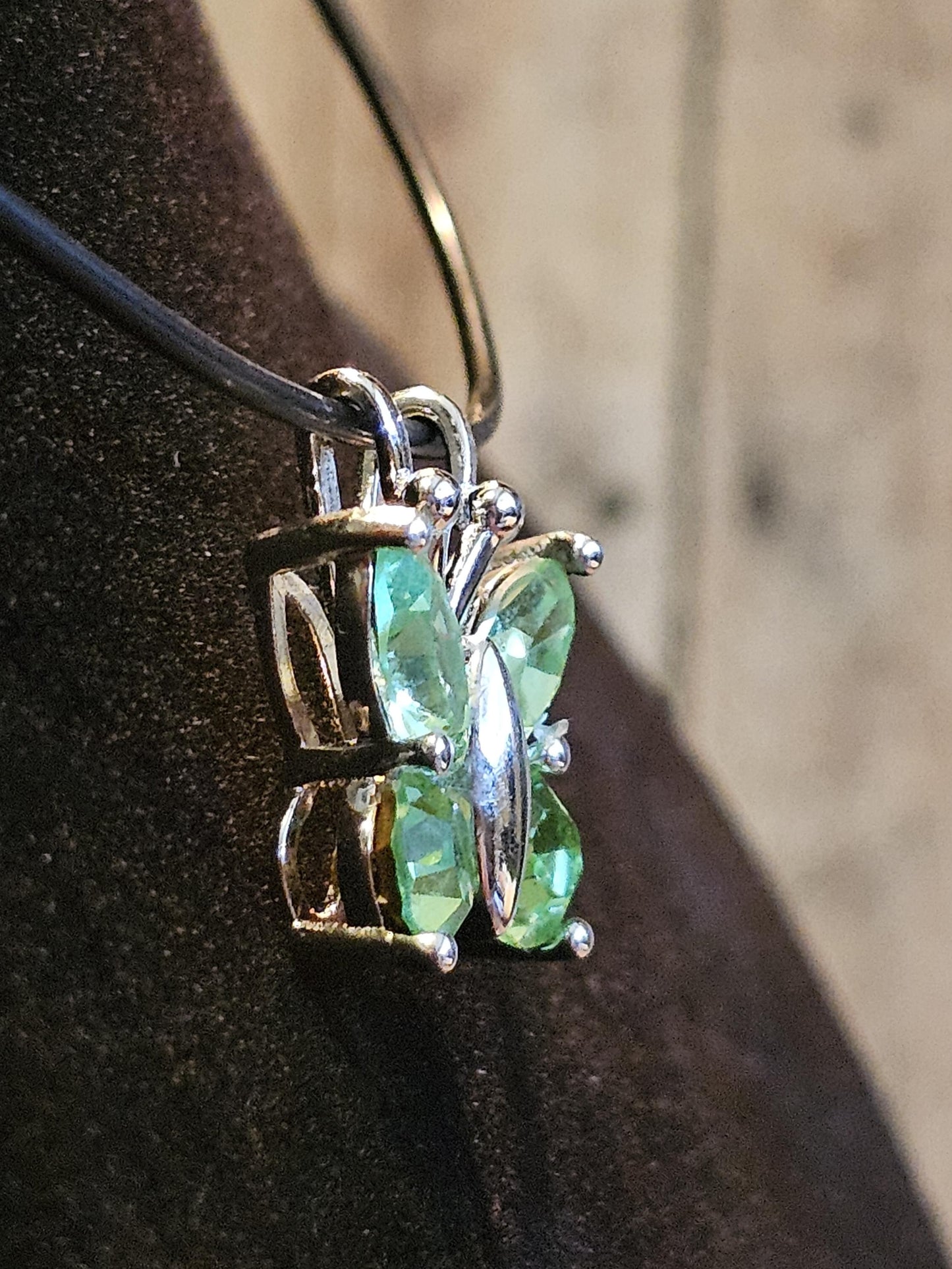 Uranium Glass Pendant in new Sterling Silver Butterfly design with Vintage Uranium Glass stones that glow under black / UV light