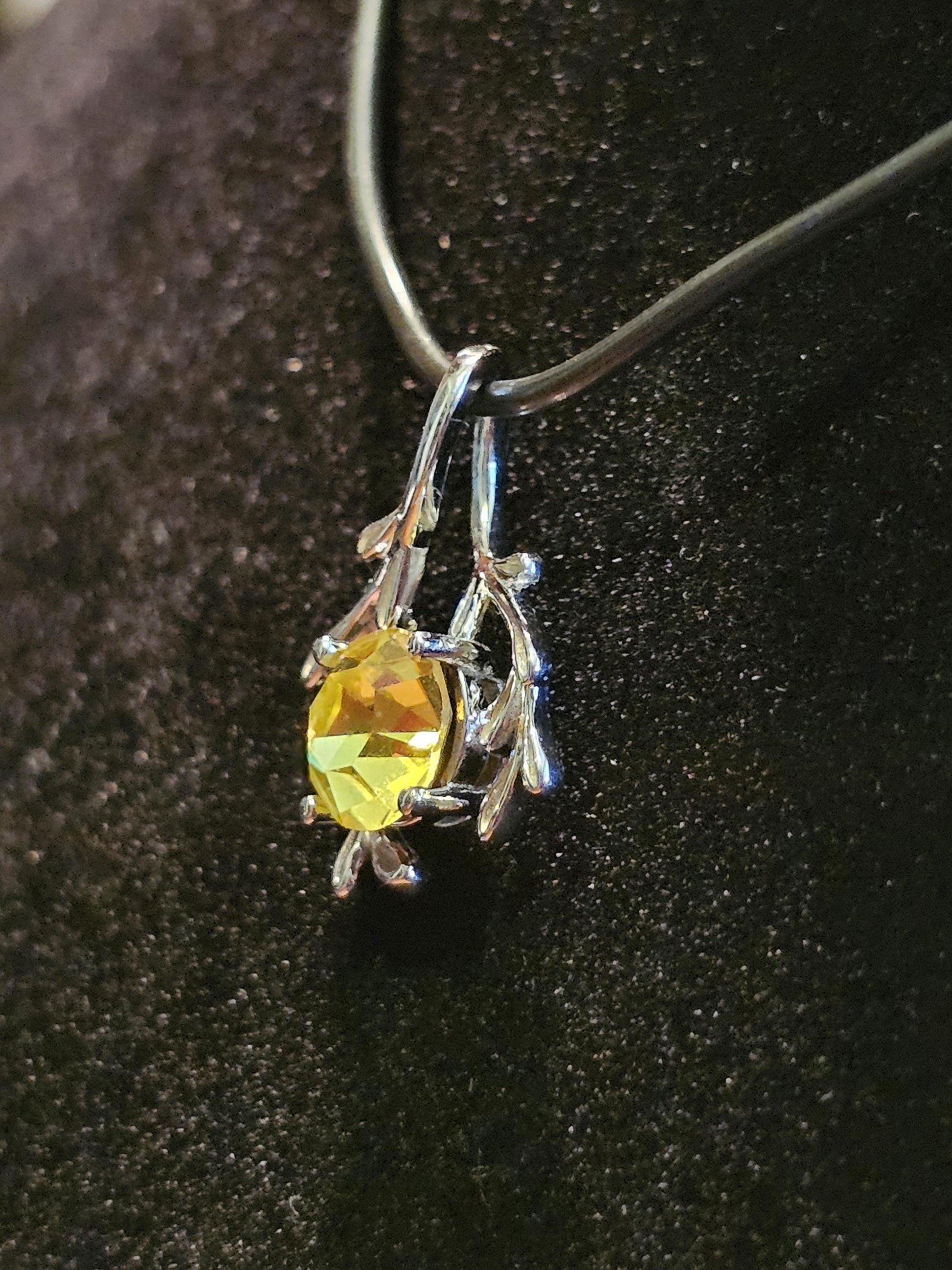 Cadmium Glass Pendant in new Sterling Silver with a vintage Round cut 7 mm Cadmium glass stone that glows under black / UV light