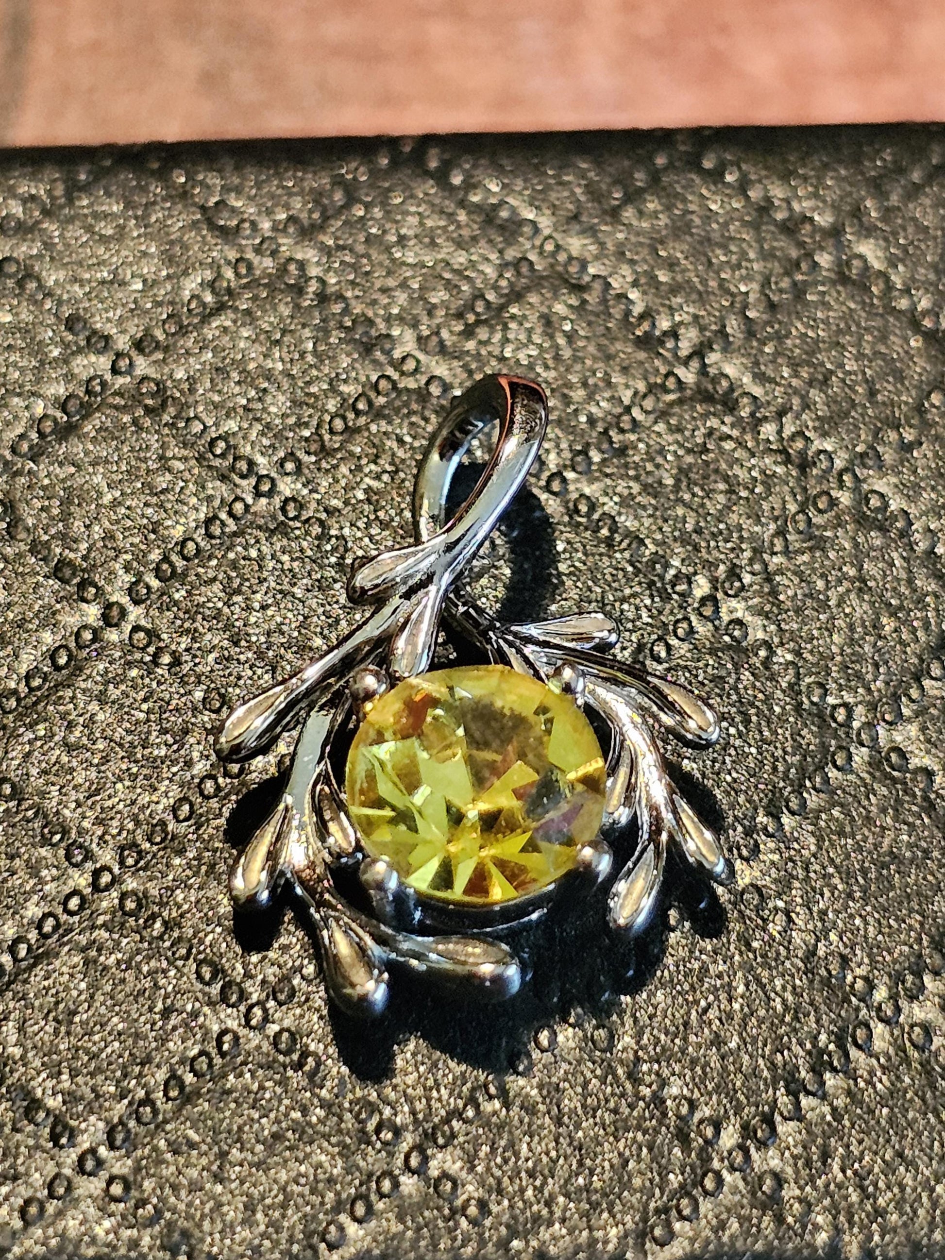 Cadmium Glass Pendant in new Sterling Silver with a vintage Round cut 7 mm Cadmium glass stone that glows under black / UV light