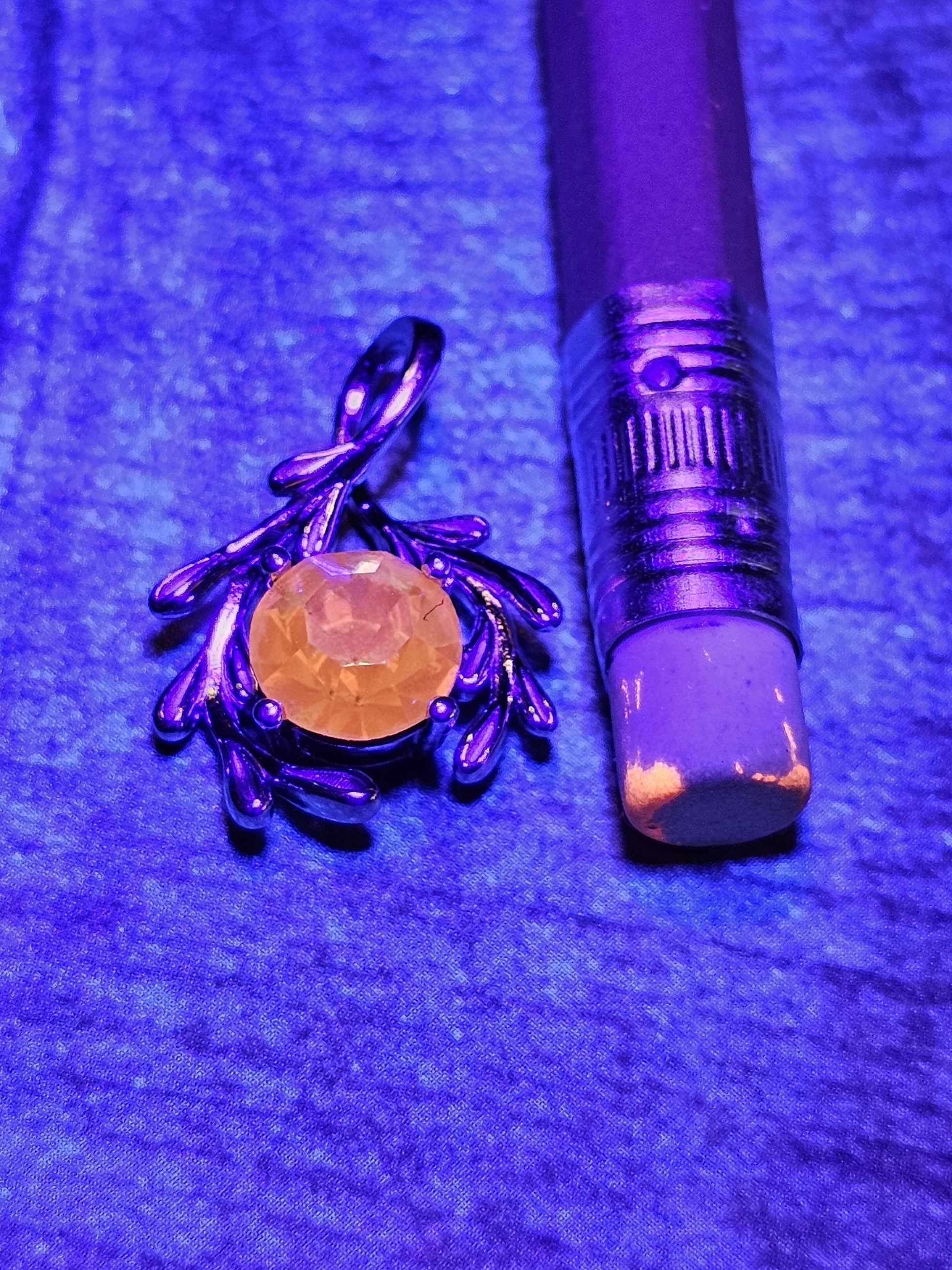 Cadmium Glass Pendant in new Sterling Silver with a vintage Round cut 7 mm Cadmium glass stone that glows under black / UV light