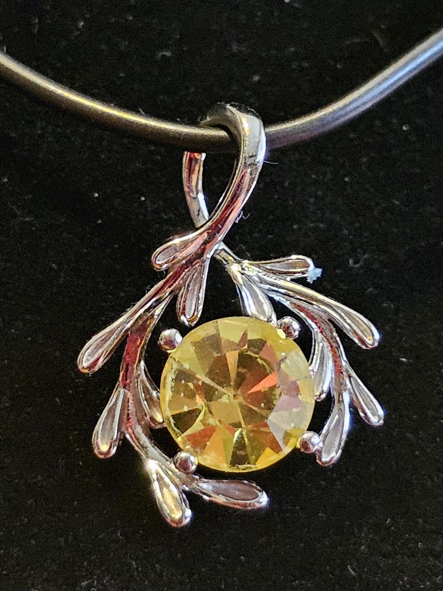 Cadmium Glass Pendant in new Sterling Silver with a vintage Round cut 7 mm Cadmium glass stone that glows under black / UV light