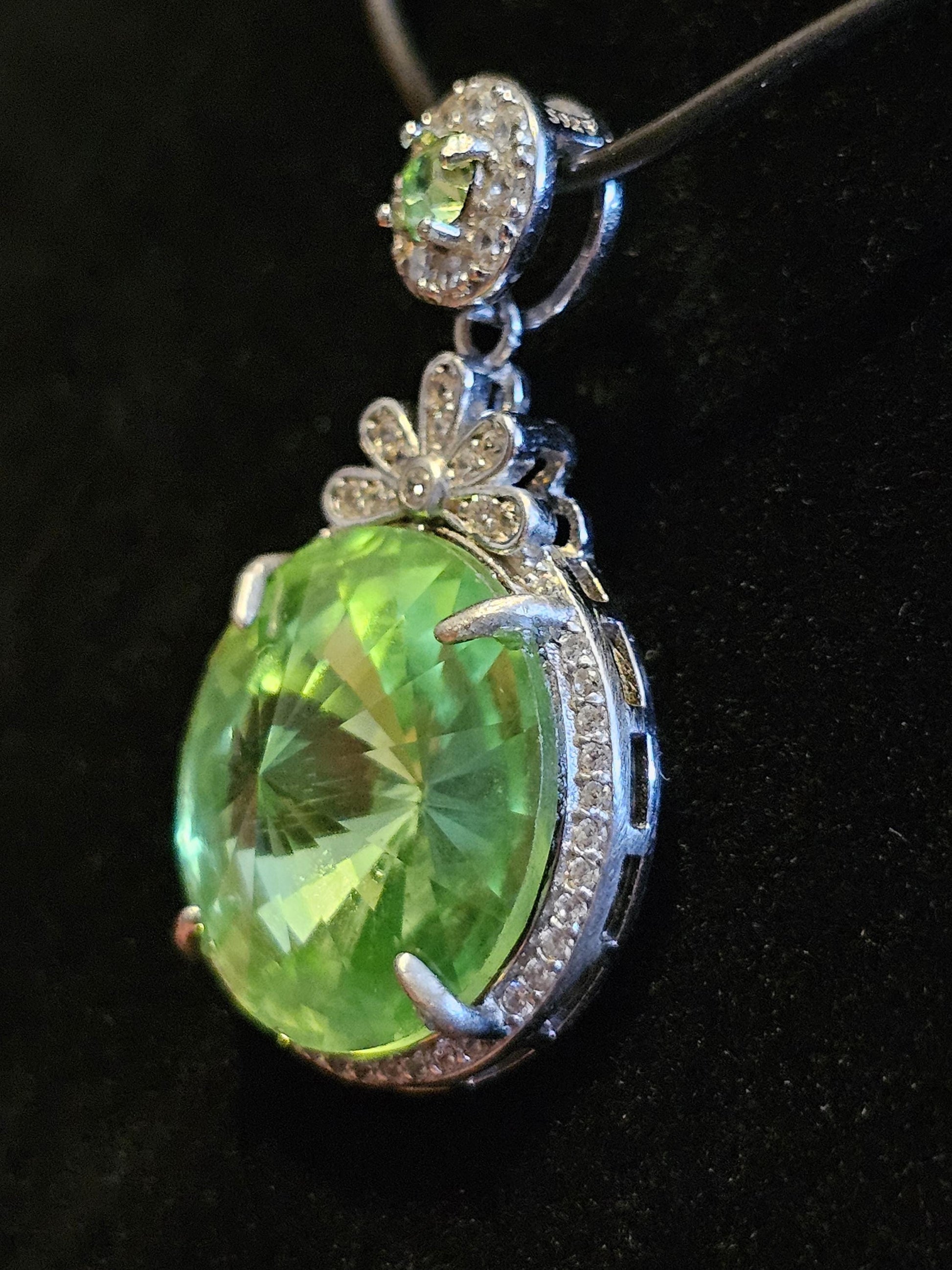 Uranium Glass Pendant new Sterling Silver with a vintage 18 mm Rivolis round cut Uranium Glass stone that glows under black / UV light
