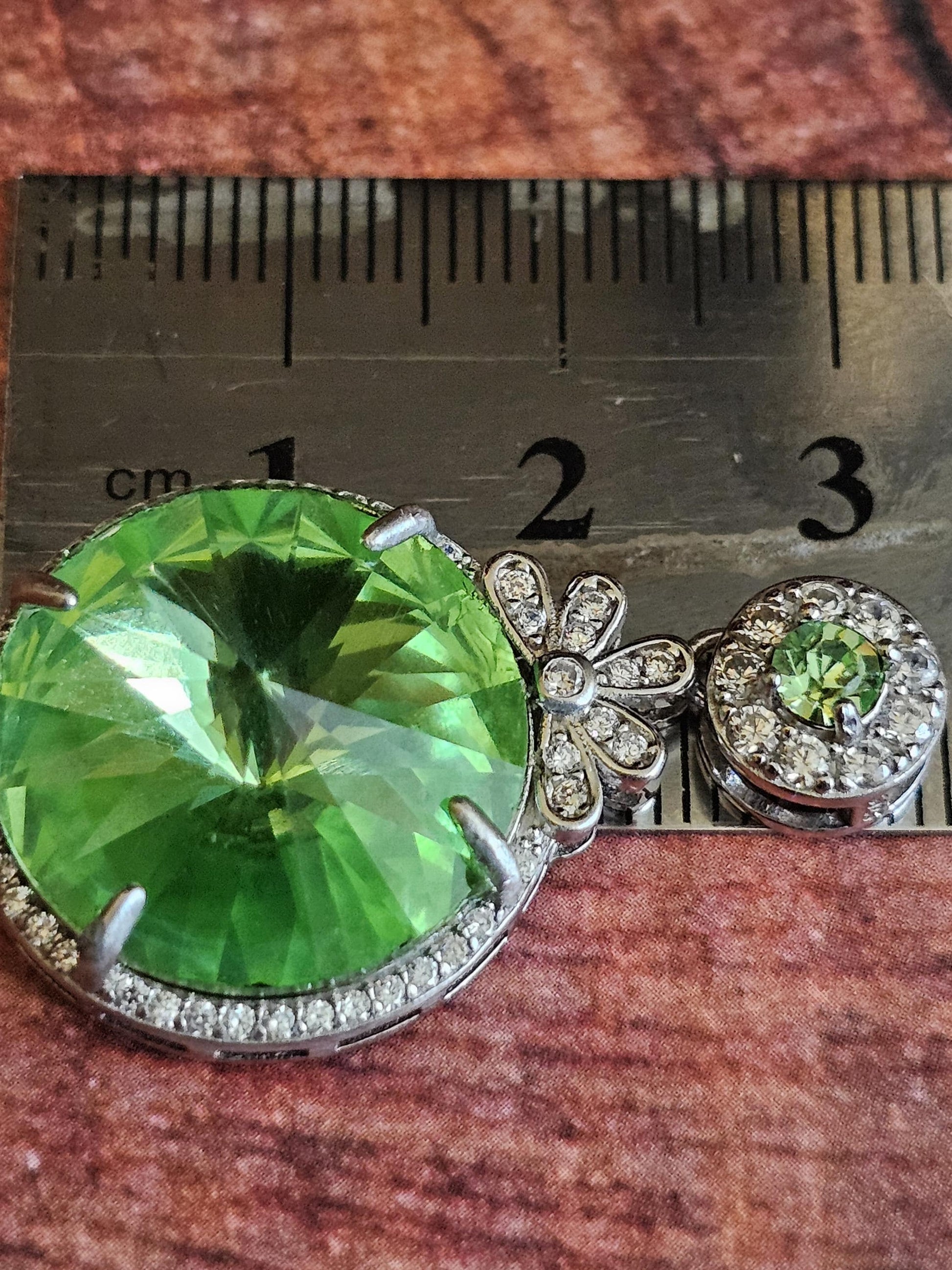 Uranium Glass Pendant new Sterling Silver with a vintage 18 mm Rivolis round cut Uranium Glass stone that glows under black / UV light