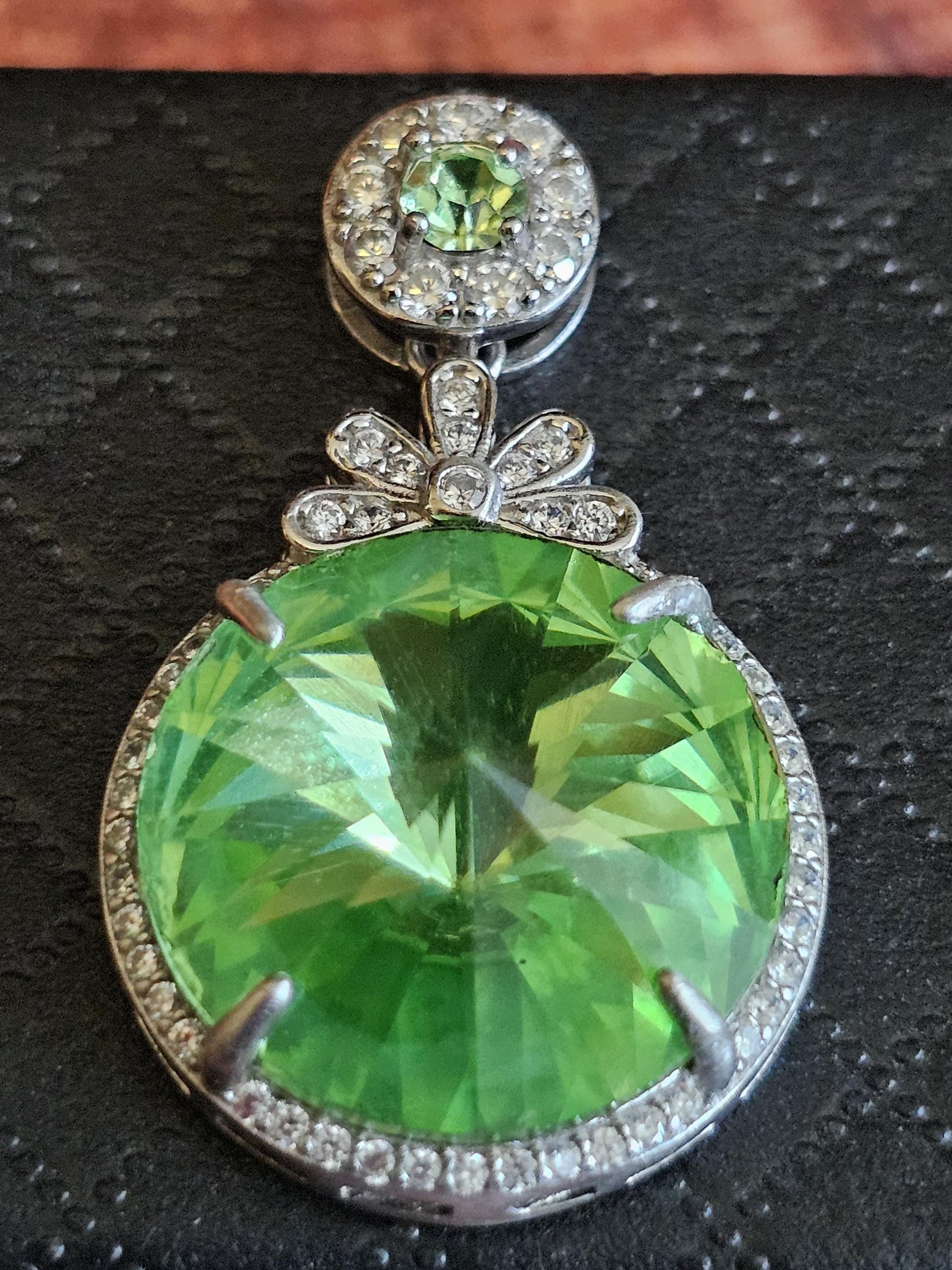 Uranium Glass Pendant new Sterling Silver with a vintage 18 mm Rivolis round cut Uranium Glass stone that glows under black / UV light