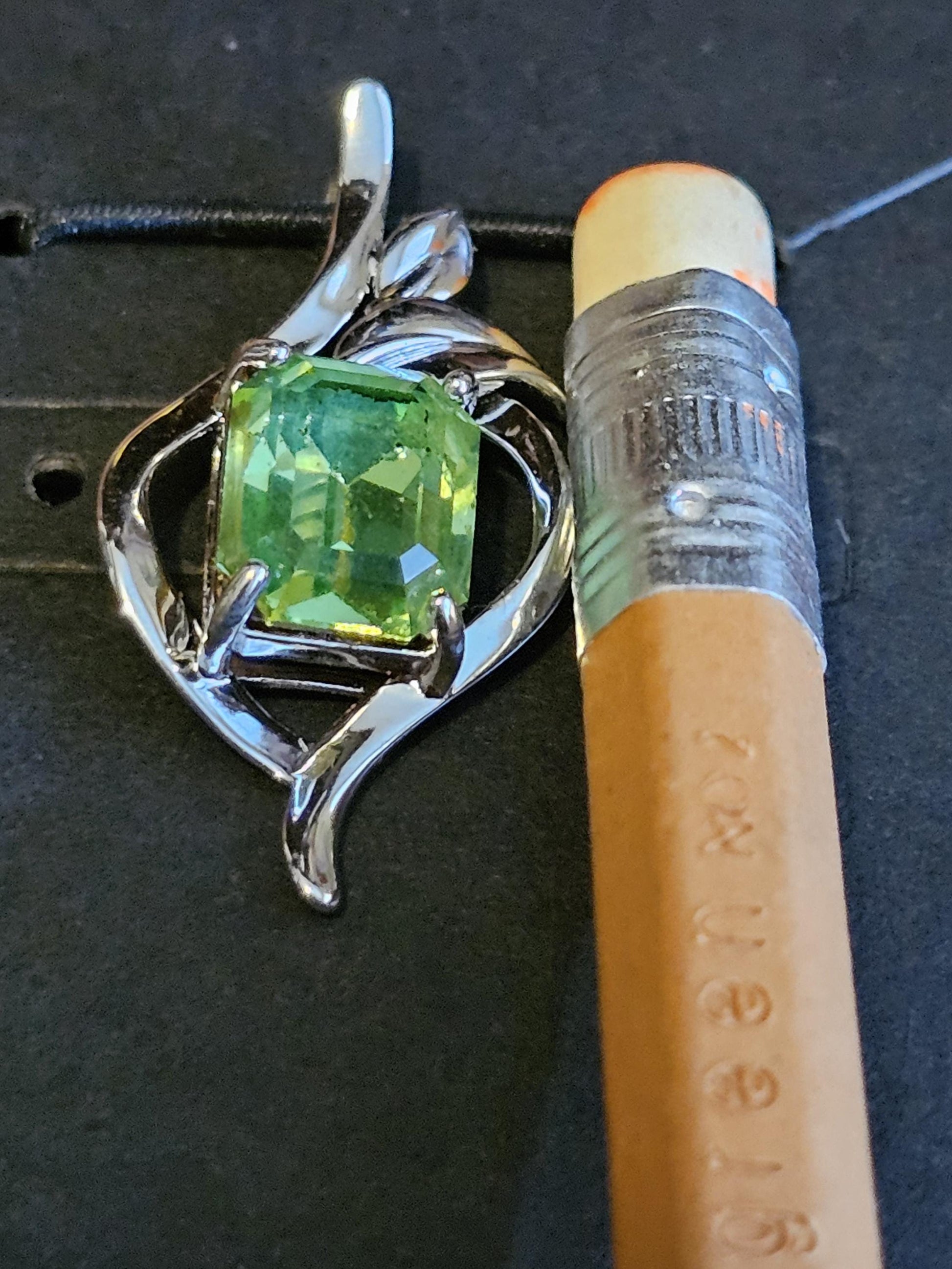 Uranium Glass Pendant in new Sterling Silver with a vintage Emerald cut Uranium Glass stone glows under black / UV light