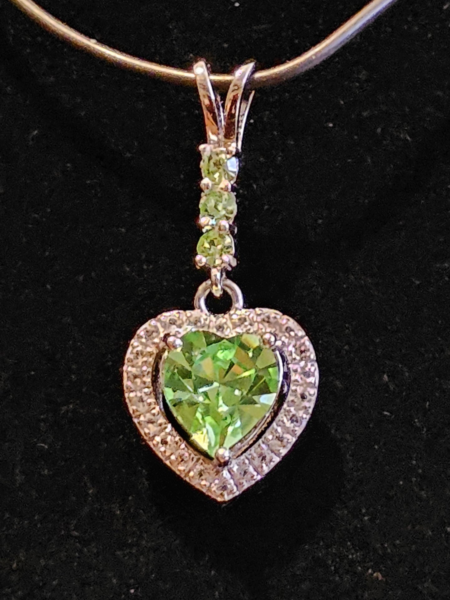 Uranium Glass Pendant in new Sterling Silver setting with 4 vintage Heart and Round cut Uranium Glass stones that glow under black/UV light