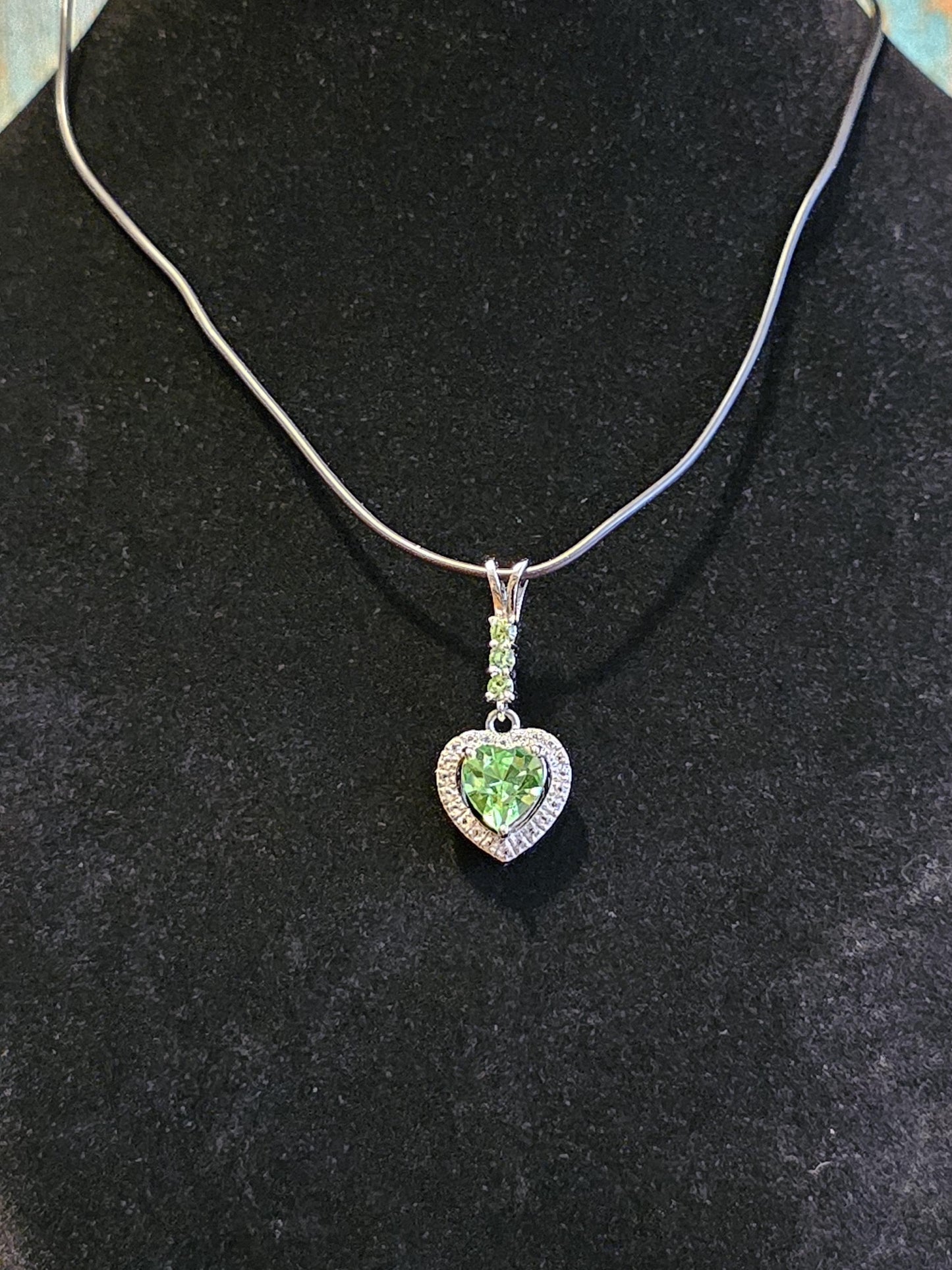 Uranium Glass Pendant in new Sterling Silver setting with 4 vintage Heart and Round cut Uranium Glass stones that glow under black/UV light