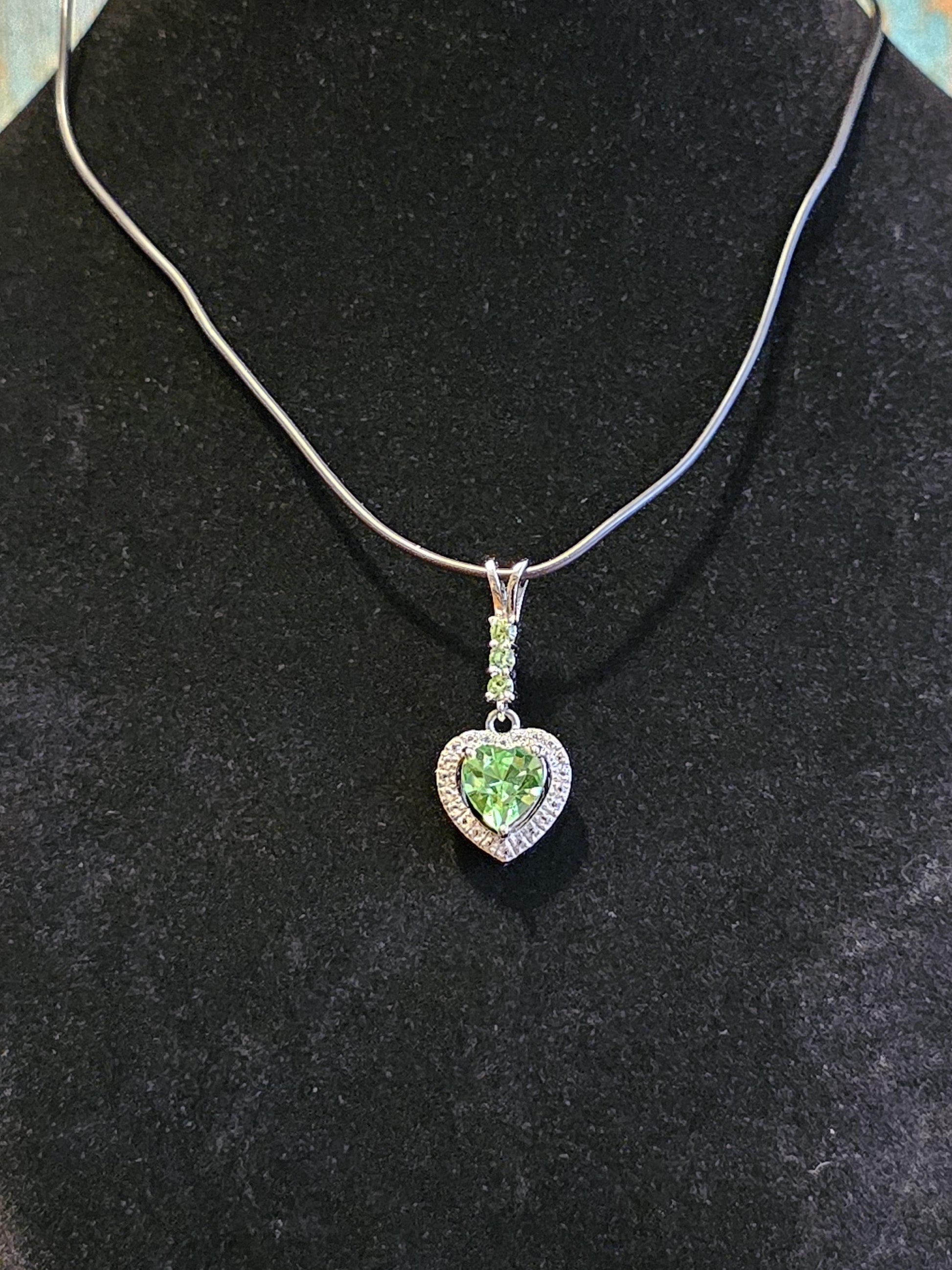 Uranium Glass Pendant in new Sterling Silver setting with 4 vintage Heart and Round cut Uranium Glass stones that glow under black/UV light