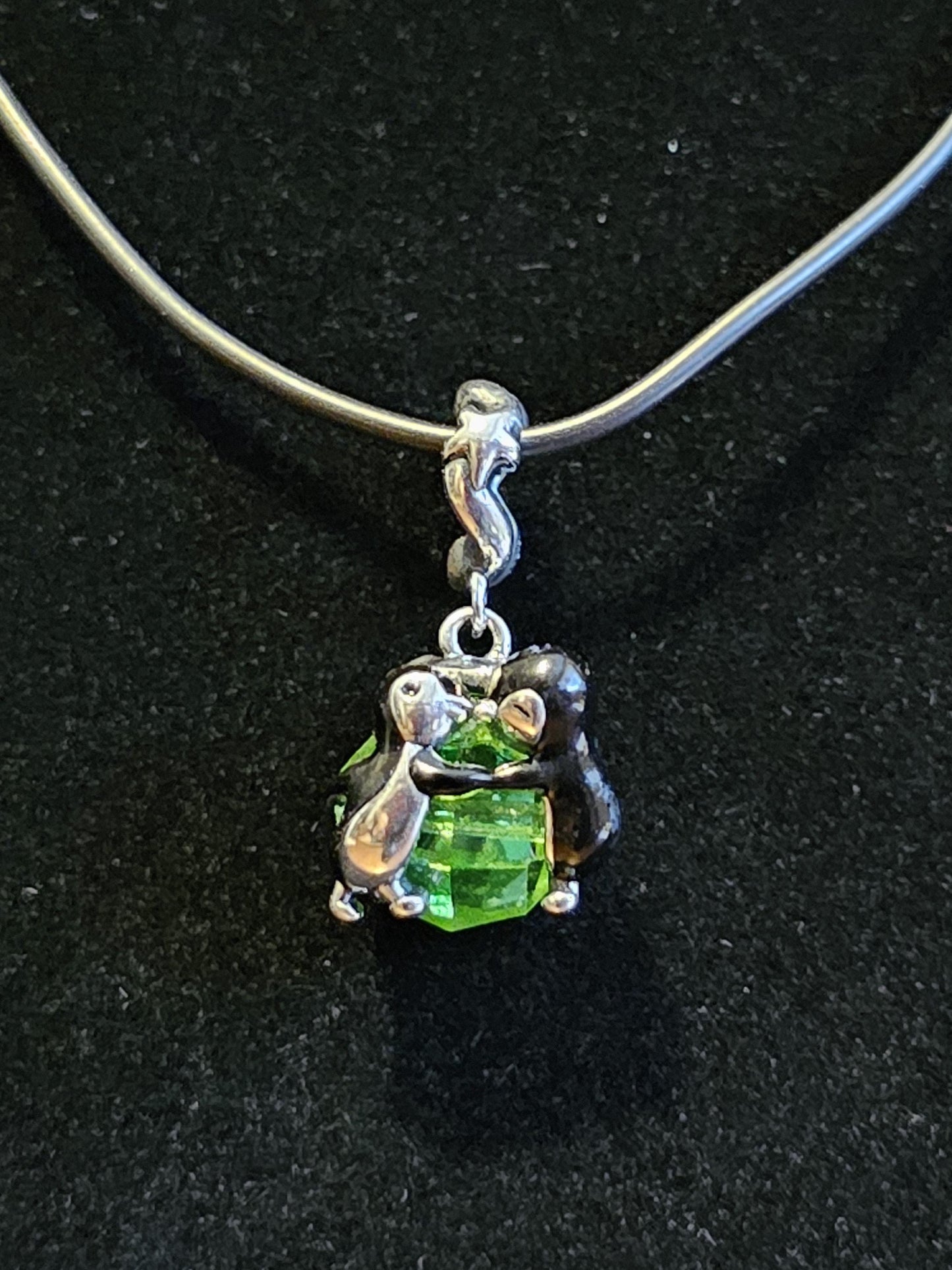 Uranium Glass Pendant in new Sterling Silver Kissing Penguins with a vintage Uranium Glass 10 mm bead that glows under black / UV light