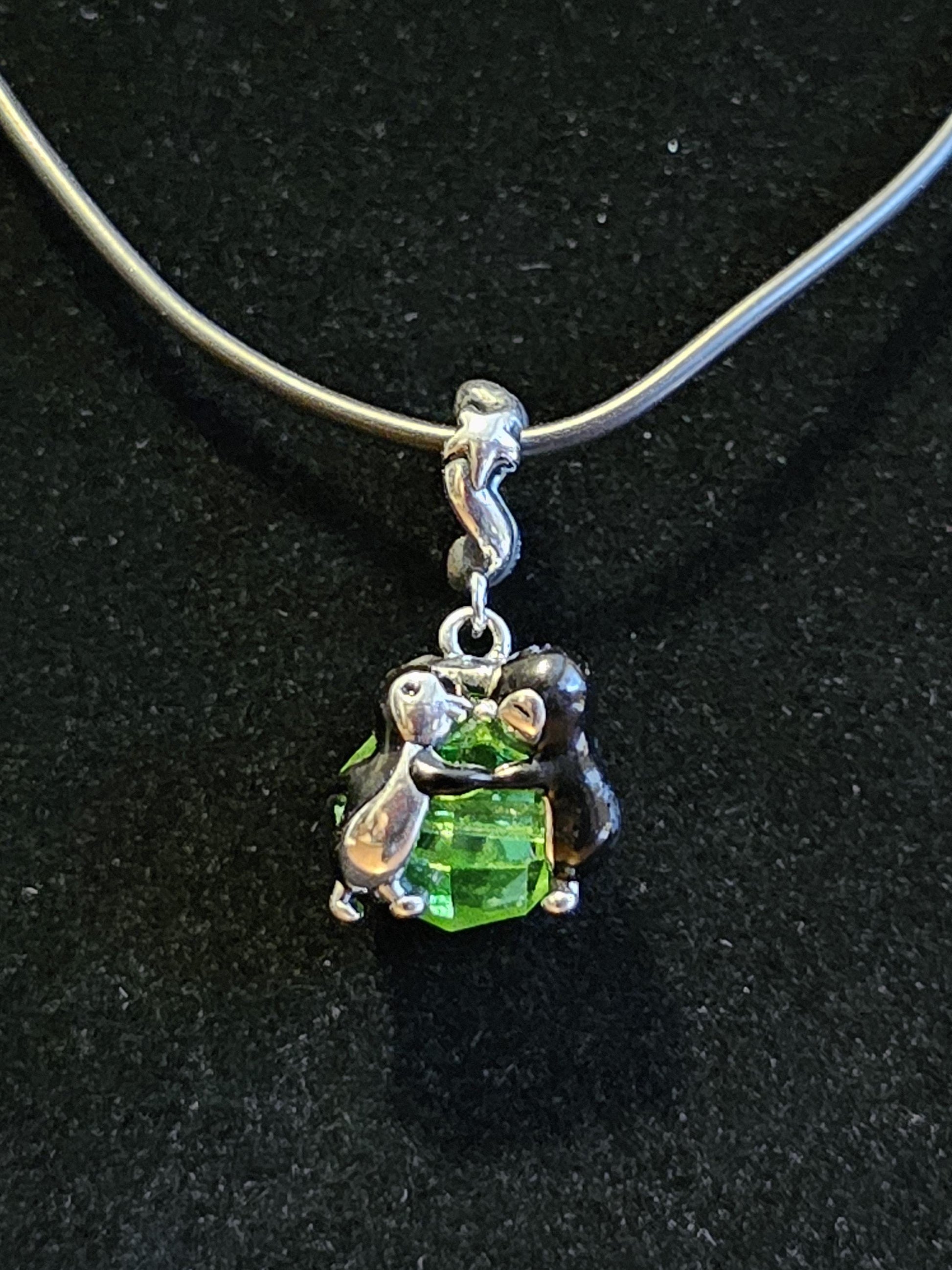 Uranium Glass Pendant in new Sterling Silver Kissing Penguins with a vintage Uranium Glass 10 mm bead that glows under black / UV light