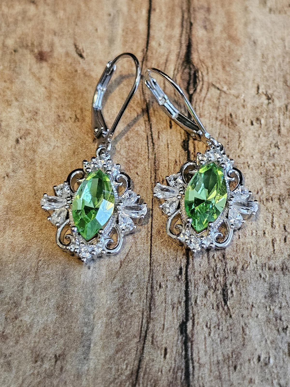 Uranium Glass Leverback Fleur De Lis Earrings Sterling Silver with Marquise cut 12x6 mm Uranium Glass stones, that glow under black/UV light