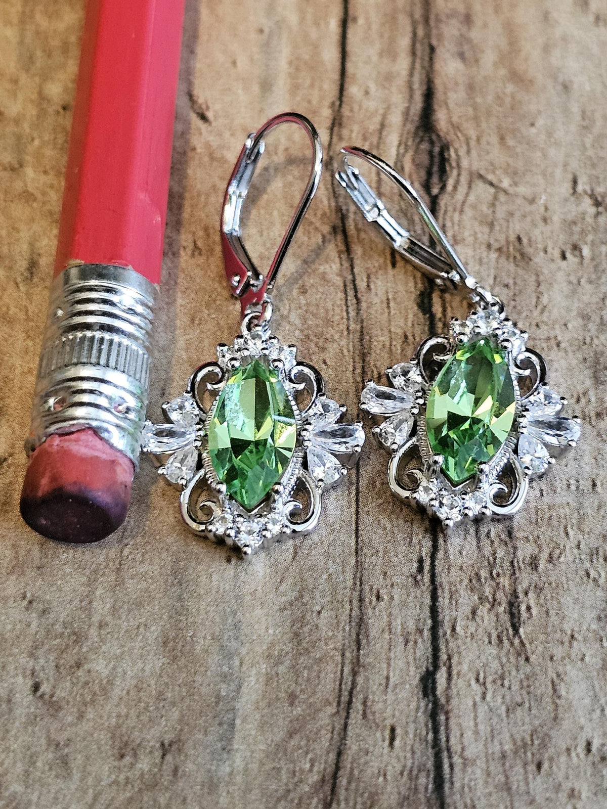Uranium Glass Leverback Fleur De Lis Earrings Sterling Silver with Marquise cut 12x6 mm Uranium Glass stones, that glow under black/UV light