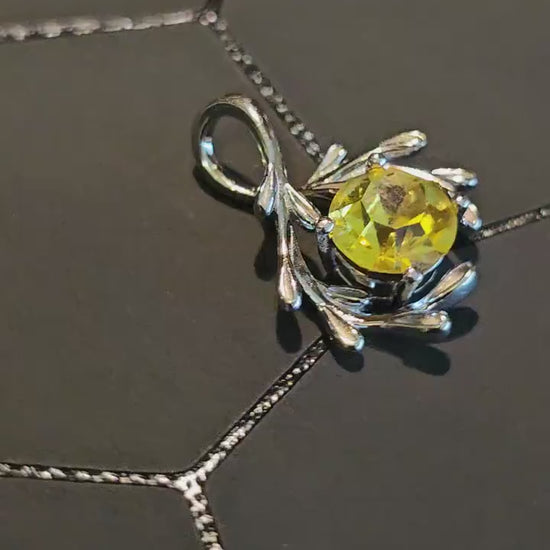 Cadmium Glass Pendant in new Sterling Silver with a vintage Round cut 7 mm Cadmium glass stone that glows under black / UV light