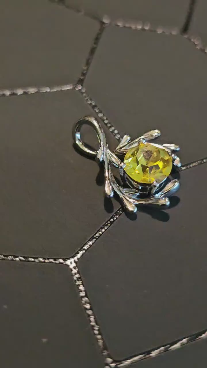 Cadmium Glass Pendant in new Sterling Silver with a vintage Round cut 7 mm Cadmium glass stone that glows under black / UV light